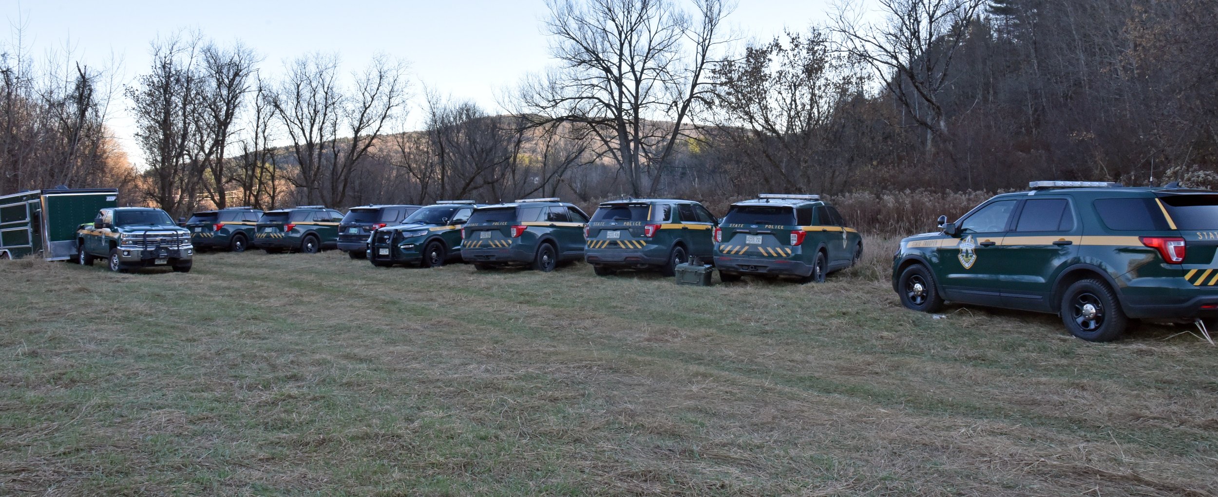  A fairly large group of state police personnel gather near the Winooski River bank in Duxbury on Monday, Nov.  7. Photo by Gordon Miller 