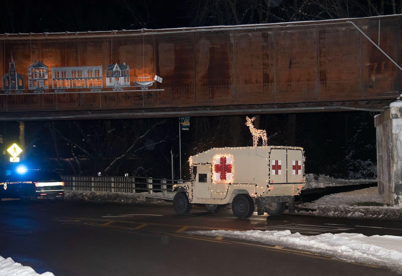   A decorated Army ambulance leads the parade following at Vermont State Police escort. Photo by Gordon Miller  