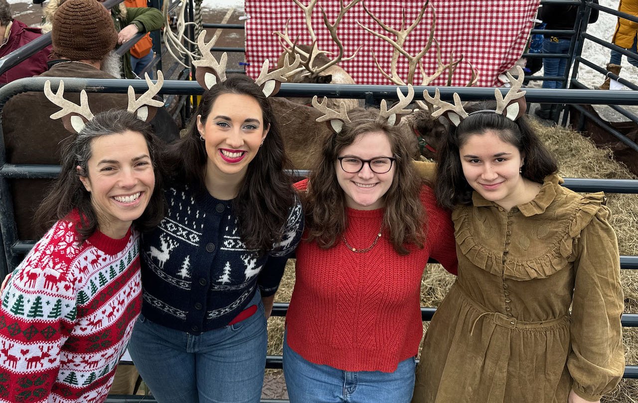   The reindeer visit is sponsored by a number of downtown businesses and organized by staff at Bridgeside Books who got into the spirit. Left to right, owner Katya d'Angelo, Jenna Danyew, XXXXXXX. Photo by Gordon Mille  