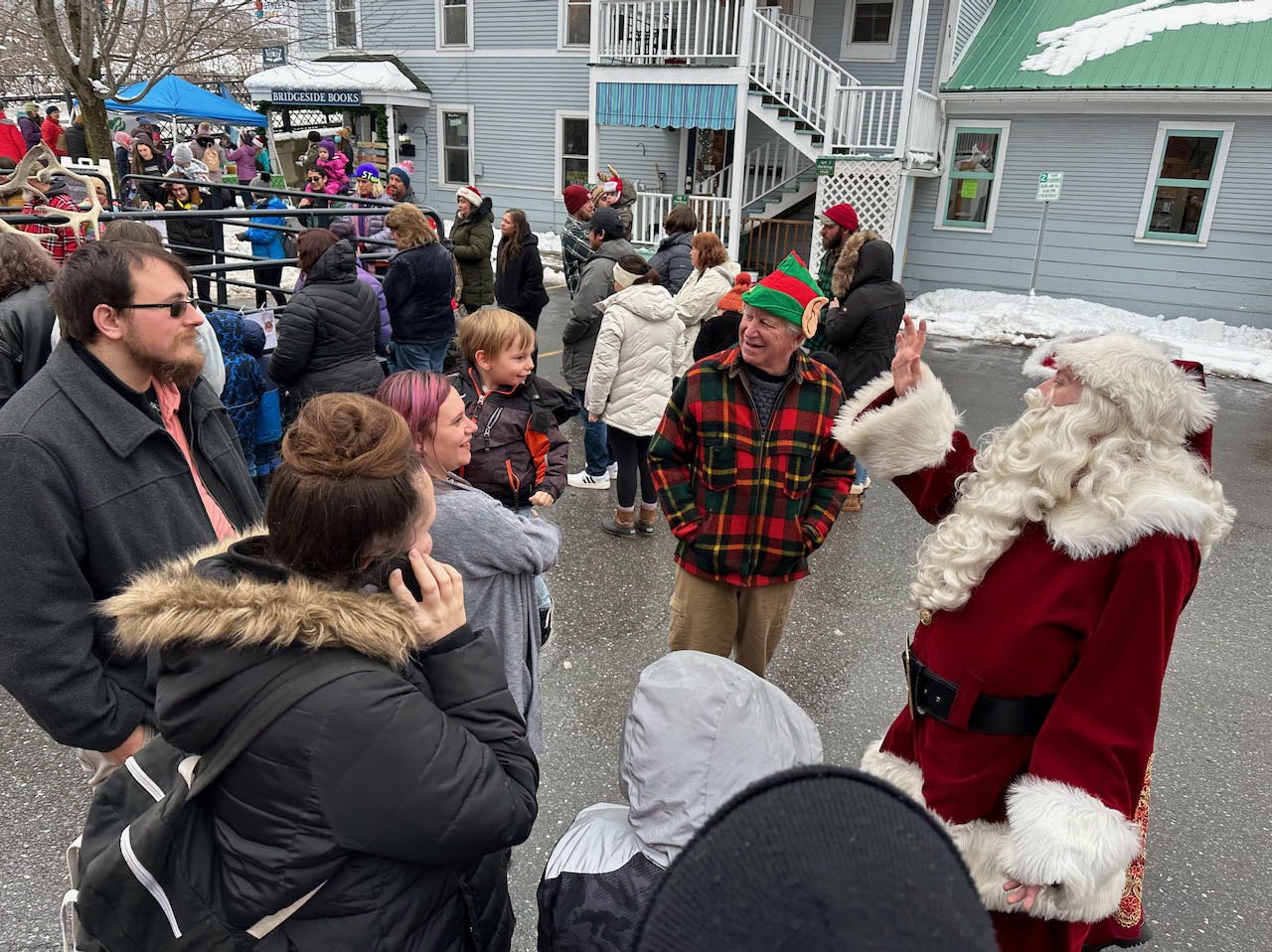   Hosted by Stowe Street Cafe, Santa Fin (a.k.a. Finbar Ciaparra of Barre) greets young and old outside. A professional special needs Santa, Santa Fin delights people around Central Vermont at the holidays. He was a guest of honor in the 2021 River o