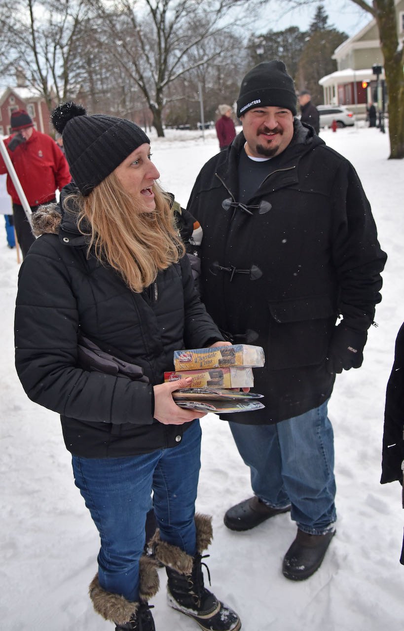   Heather and Eric Friedman of Waterbury have helped the Simons settle into their new community. Photo by Gordon Miller  