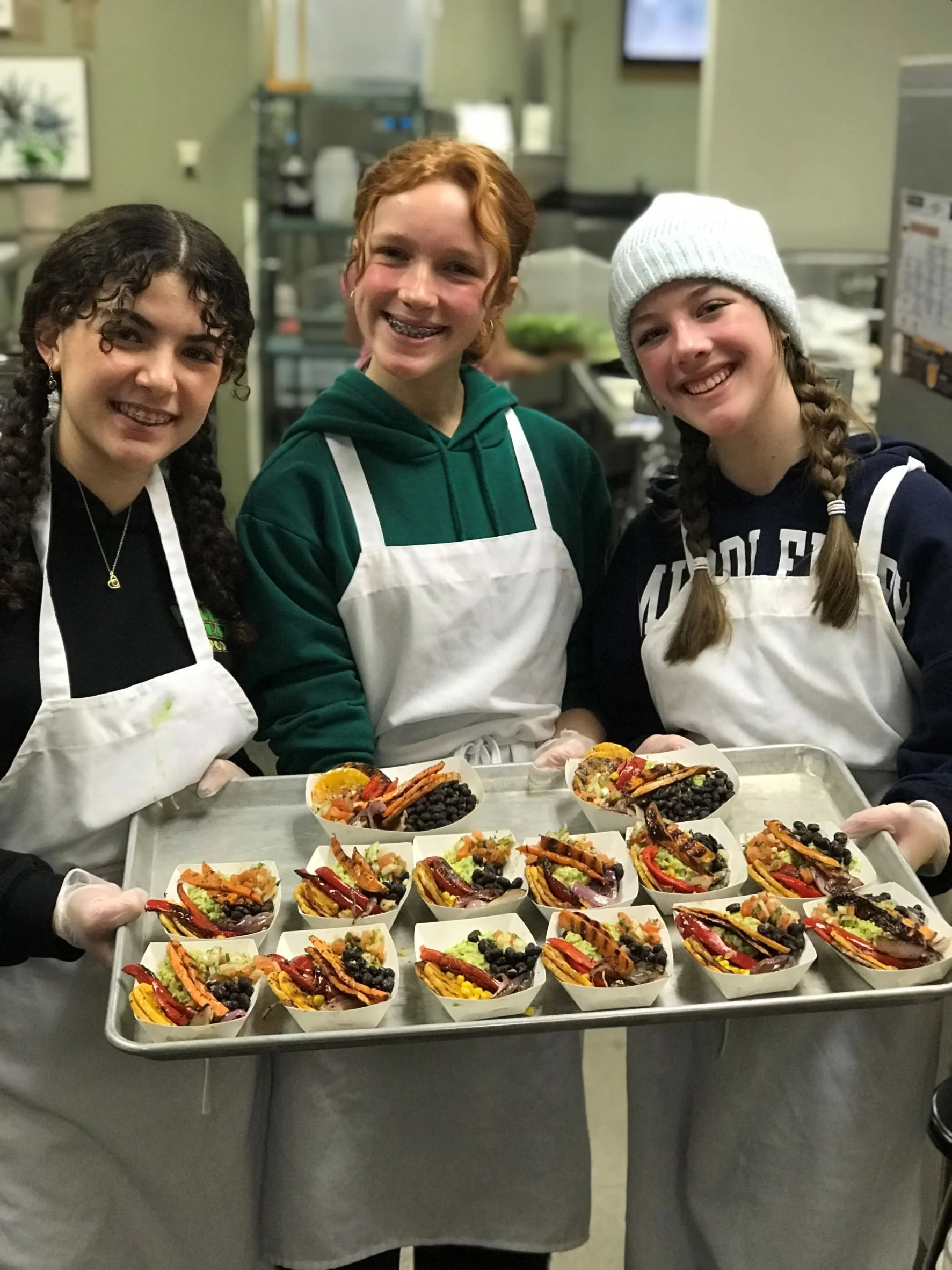   Prepping for the competition. Eighth graders Sophia DeSanto, Julia Cisz, Charlotte Burks. Photo by Erika Dolan  
