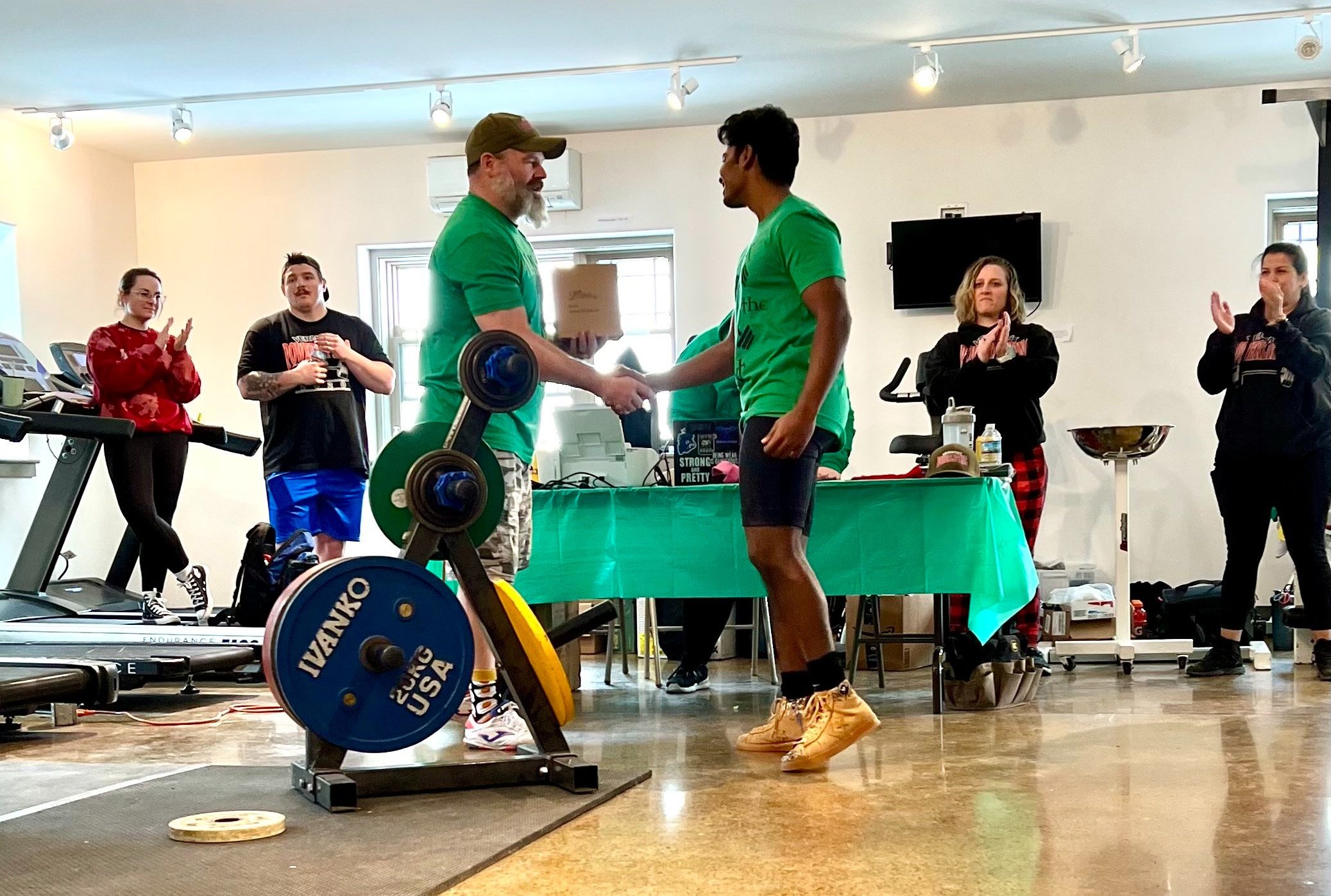   Head Judge Mike Berby congratulates Jeswin Antony. Photo by Heather Smith  