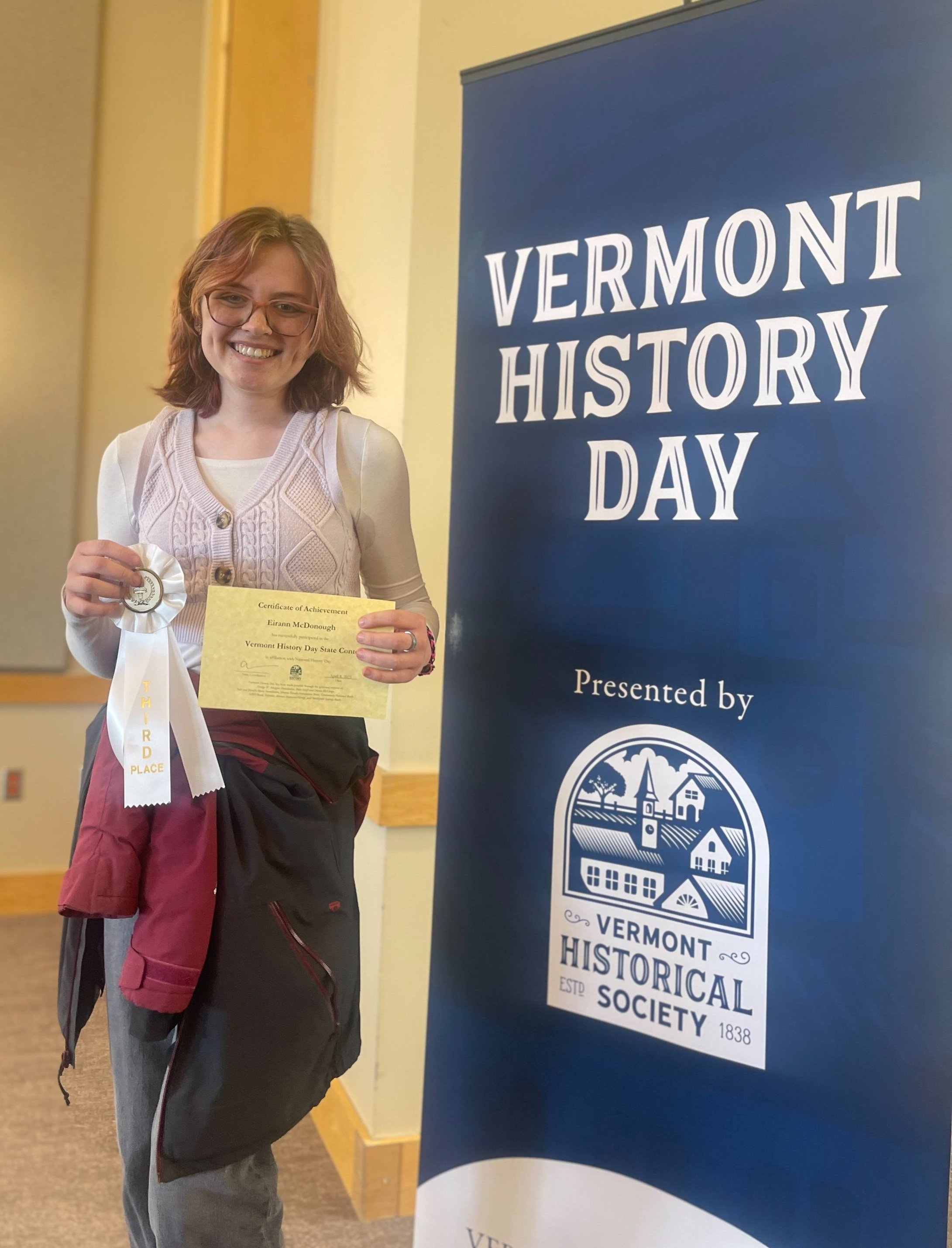   Eiraan McDonough with a first-place ribbon for "Taylor Swift in History." Photo courtesy the Vermont Historical Society  