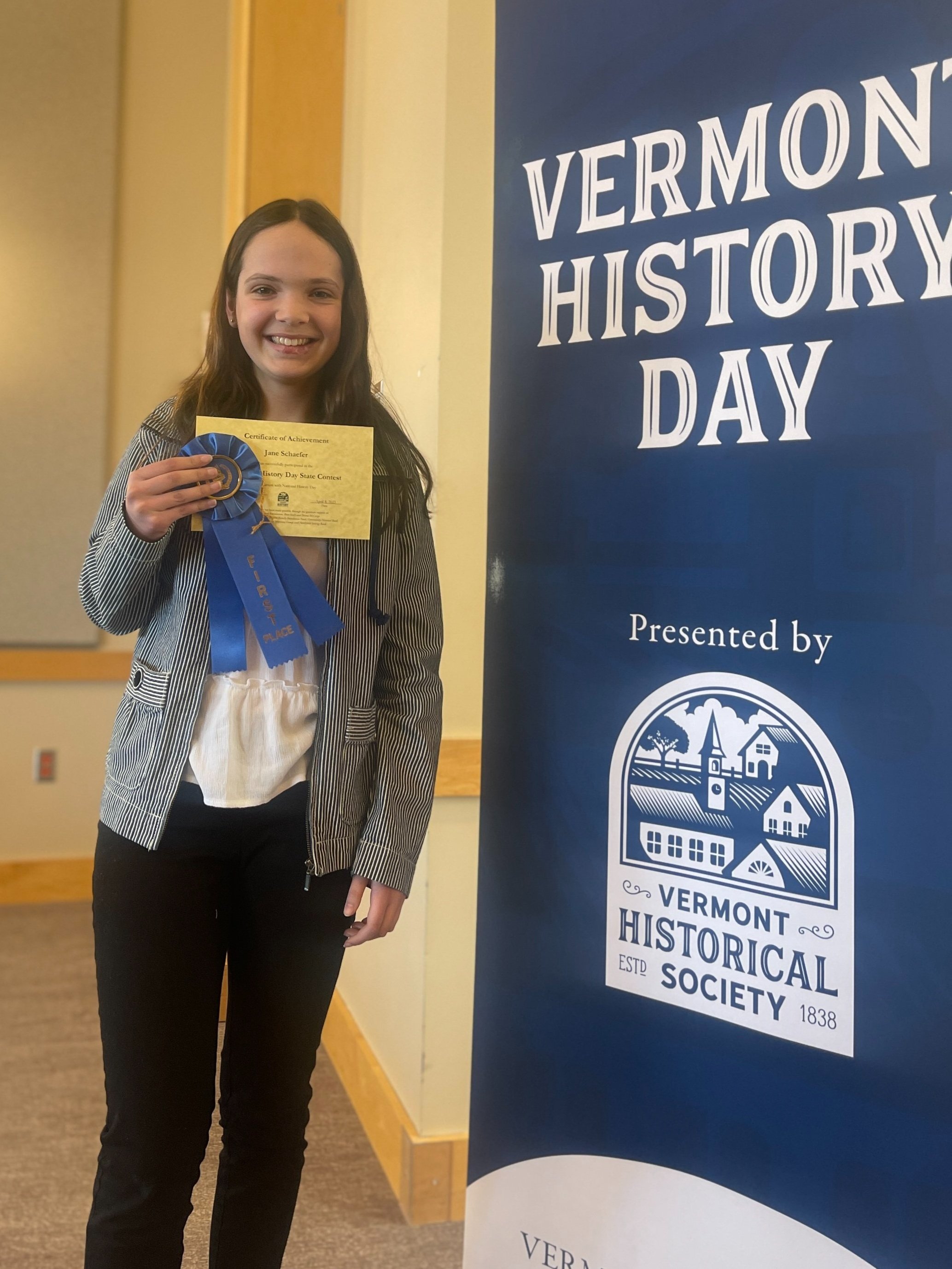   Harwood Middle School student Jane Schaefer with her first place ribbon for "Sister Kenny Live and In Person," which won for Junior Individual Performance. Photo courtesy the Vermont Historical Society  