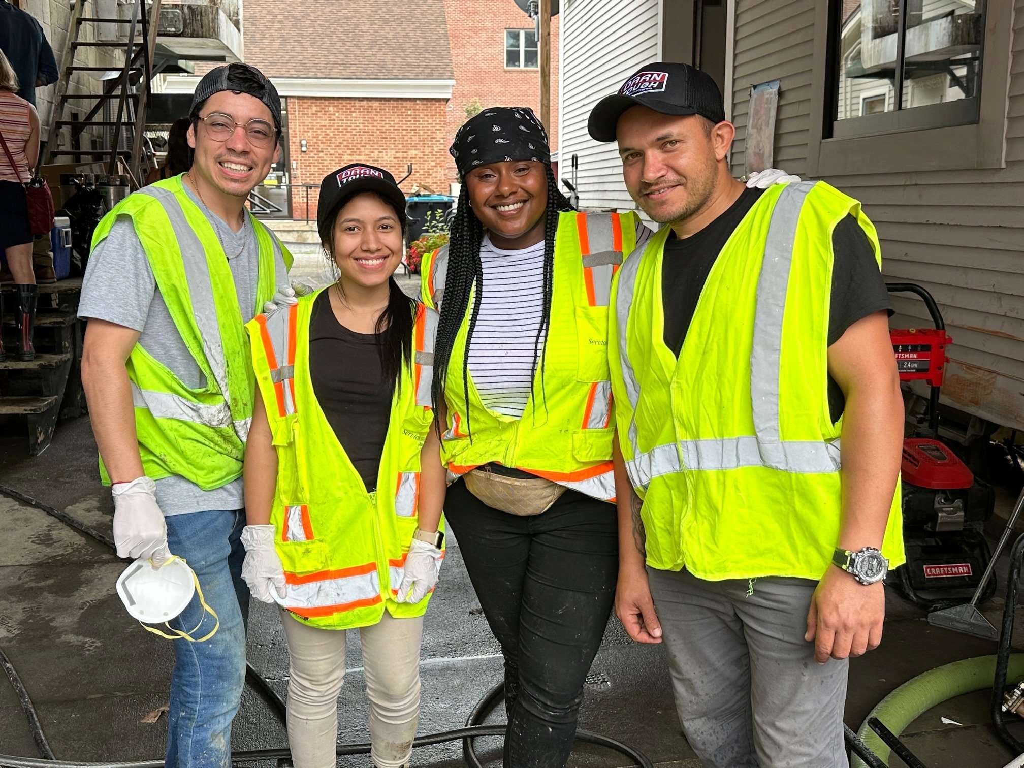 Welch tours flood zone amidst mud, cleanup, free lunch, socks, music ...