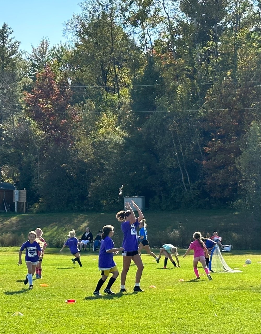  High school players toss candy in the air for their charges to catch. Photo by Lisa Scagliotti 