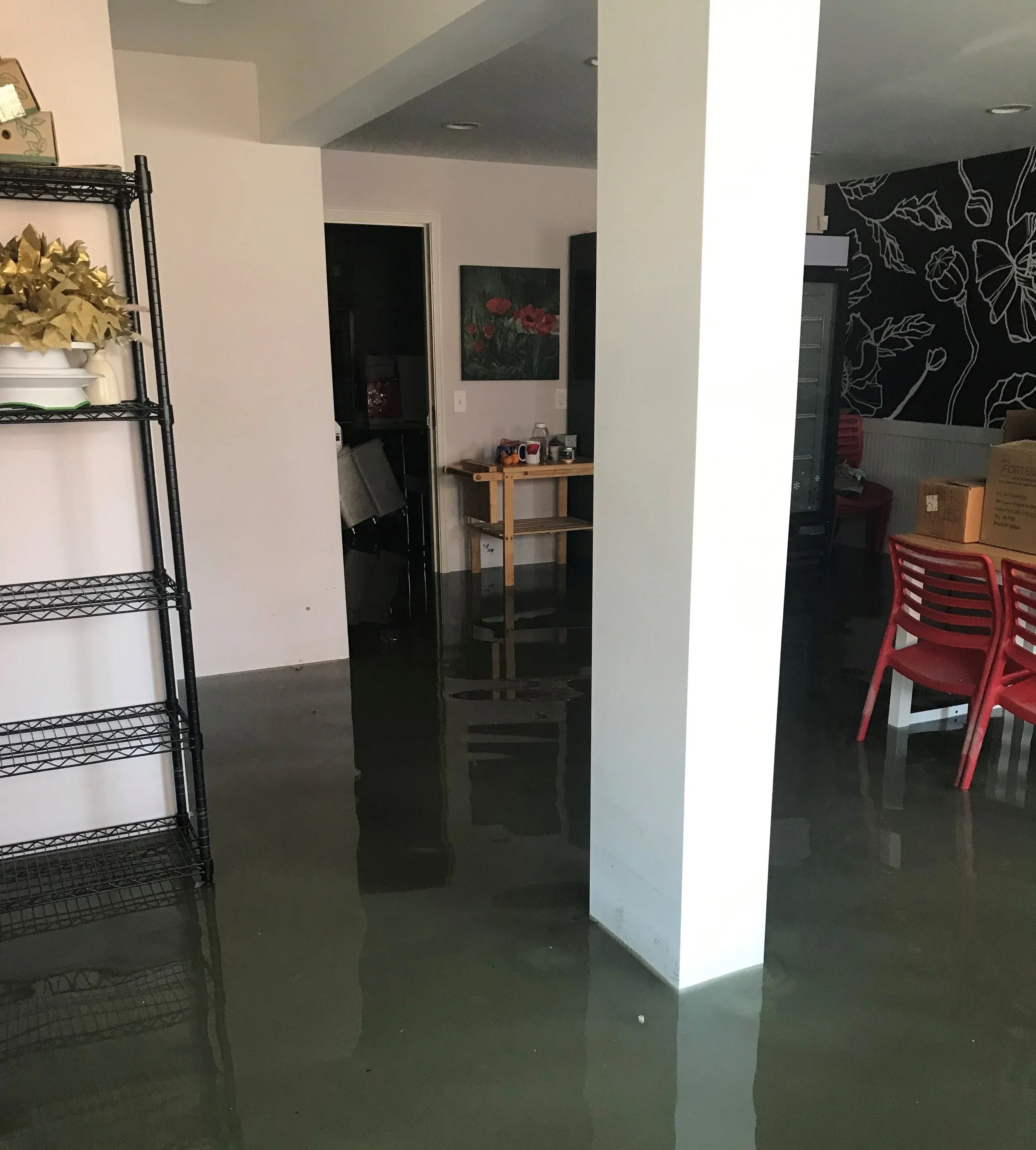 Flood water inside Red Poppy Cakery. Courtesy photo