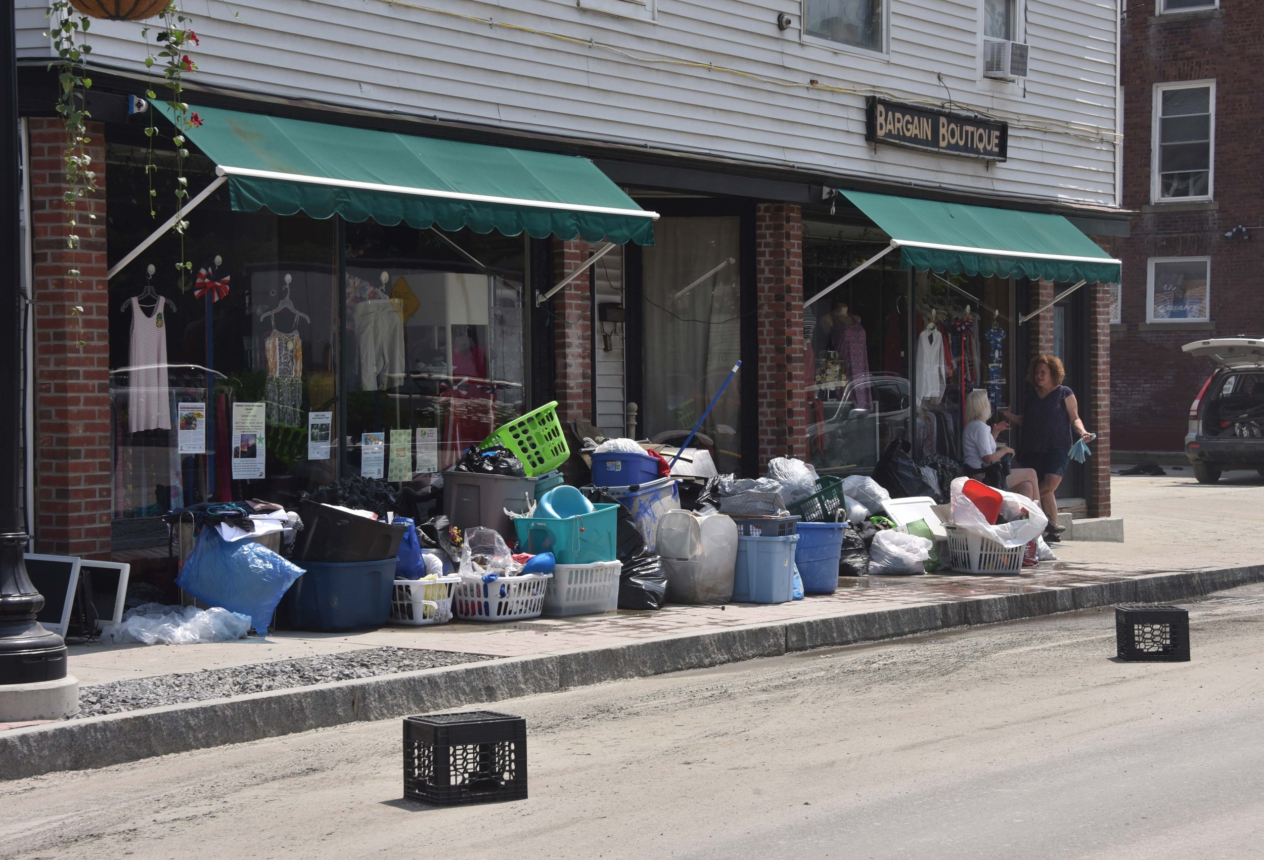  Clean-out is in full swing about  week after the flood at Bargain Boutique. Photo by Gordon Miller 