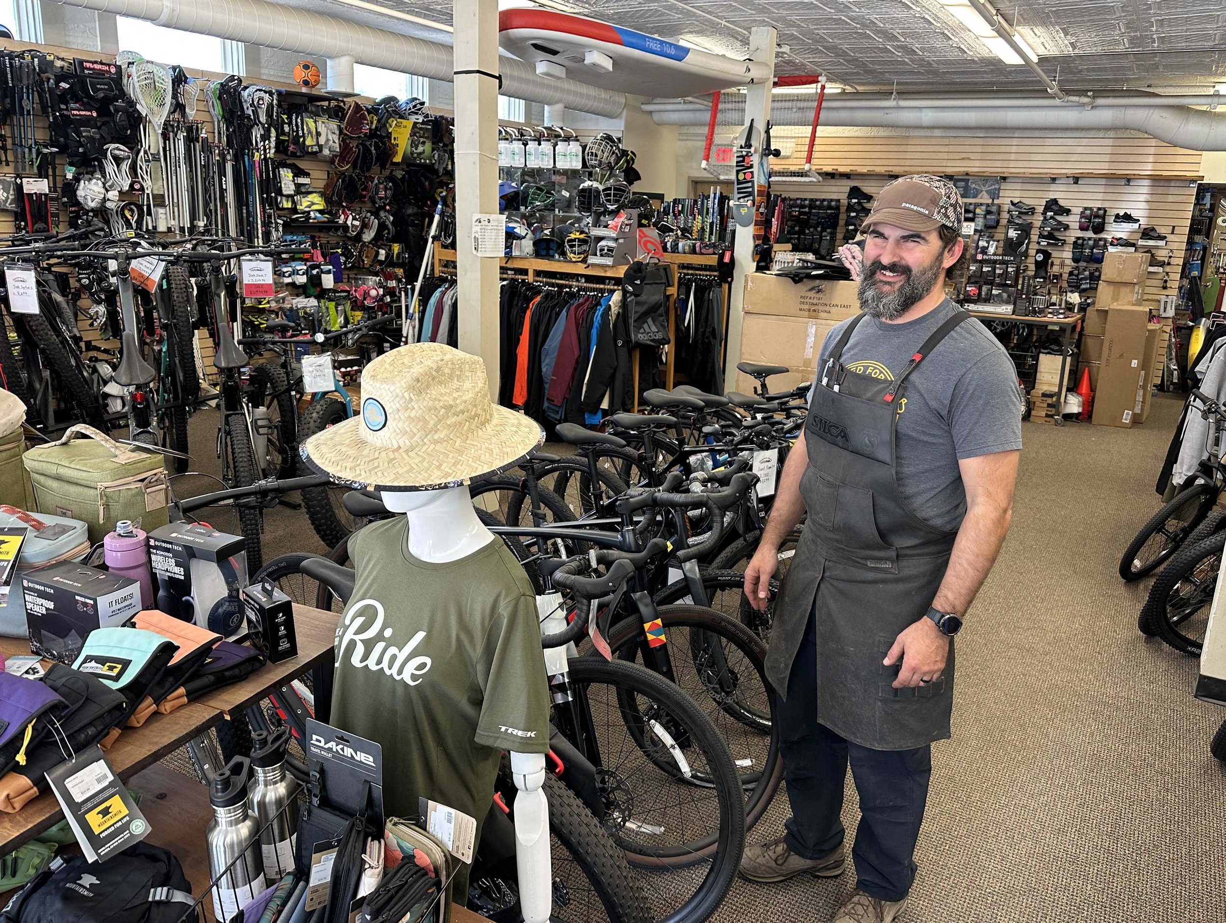  Waterbury Sports co-owner Ryan McGuire is back on the sales floor as the shop returns to normal. Photo by Gordon Miller    