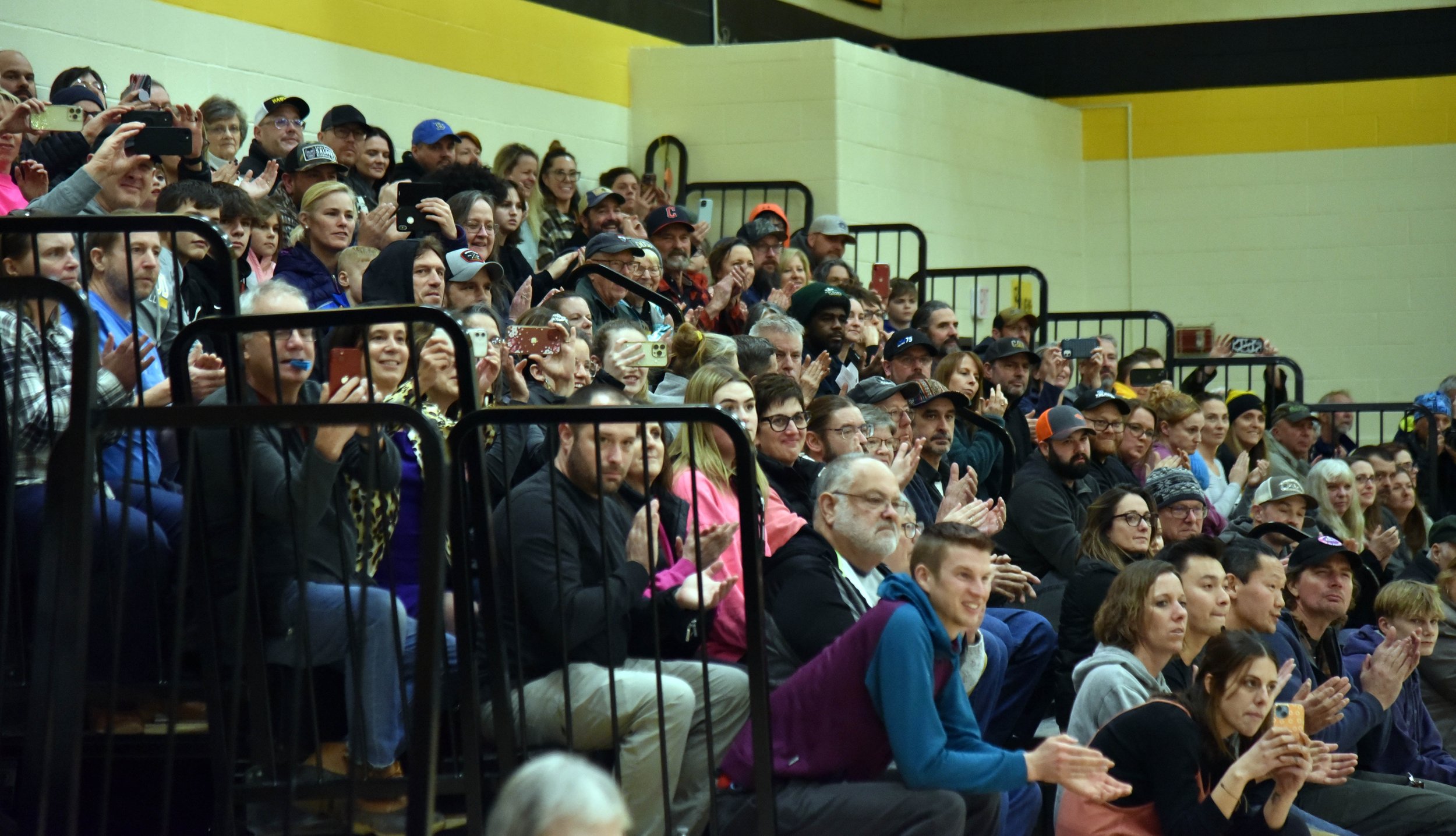  The banner hanging took place with a full house in between JV and Varsity Boys Basketball games on Friday, Feb. 9. Photo by Gordon Miller 