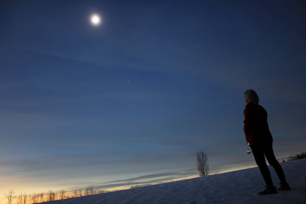   Kit Walker and husband Rob Hofmann watched from Sweet’s Meadow on Sweet Road in Waterbury Center. Photo by Rob Hofmann  