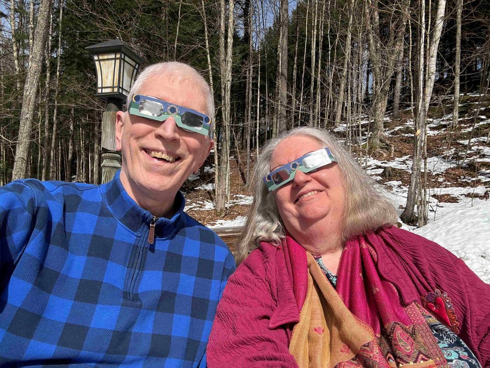   Robert Wescott and Sarah Page watch from their yard in Duxbury. Page saw another solar eclipse as a girl on a trip to the Canadian Maritimes. Both times, she said "I felt a great sense of awed peace." Photo by Robert Wescott  