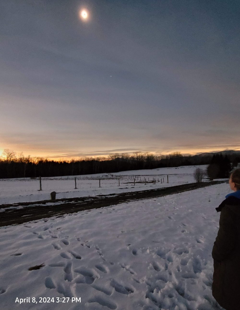   Sue Gruschow watched near the solar panel field on Sweet Road in Waterbury Center. "We could see stars!" she said.  