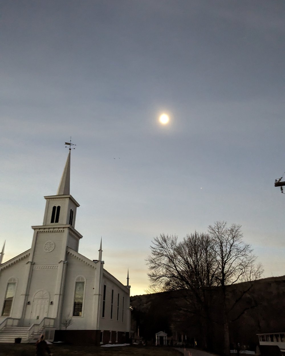   The eclipse and a planet above the Waterbury Congregational Church on North Main Street. Photo by Sarah Lepore  