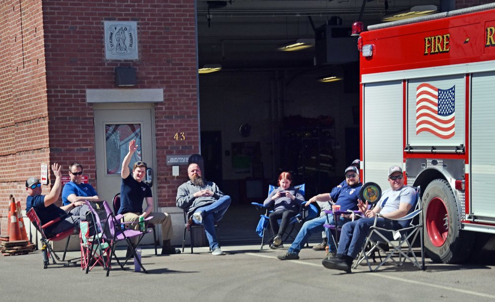   Waterbury Fire Department members settle in to be ready if needed Photo by Gordon Miller  