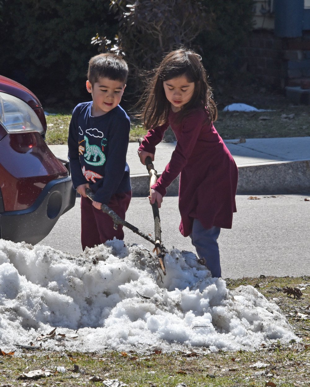   Snow piles from the previous storm are melting quickly. Photo by Gordon Miller  