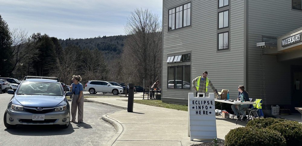   Recreation Director Katarina Lisaius gives directions to visitors (left) at the municipal offices. Photo by Lisa Scagliotti  