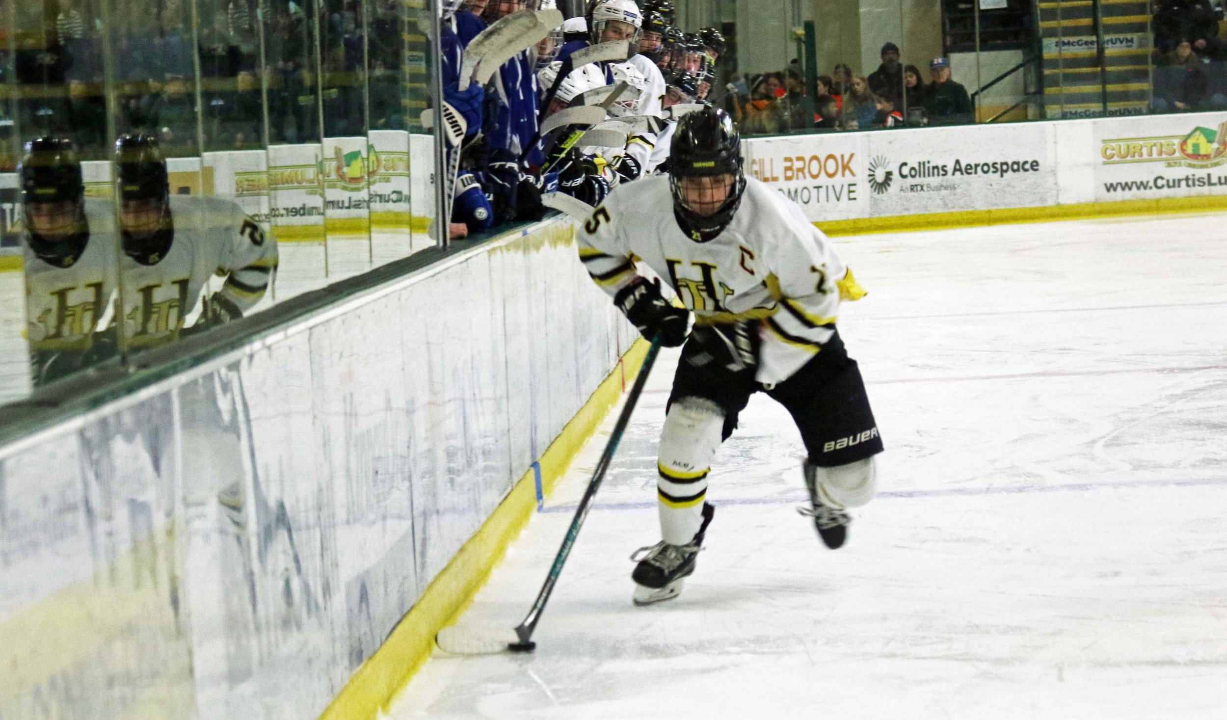  Captain Milo Lavit races up the ice along the benches. Photo by Brian Larrabee 