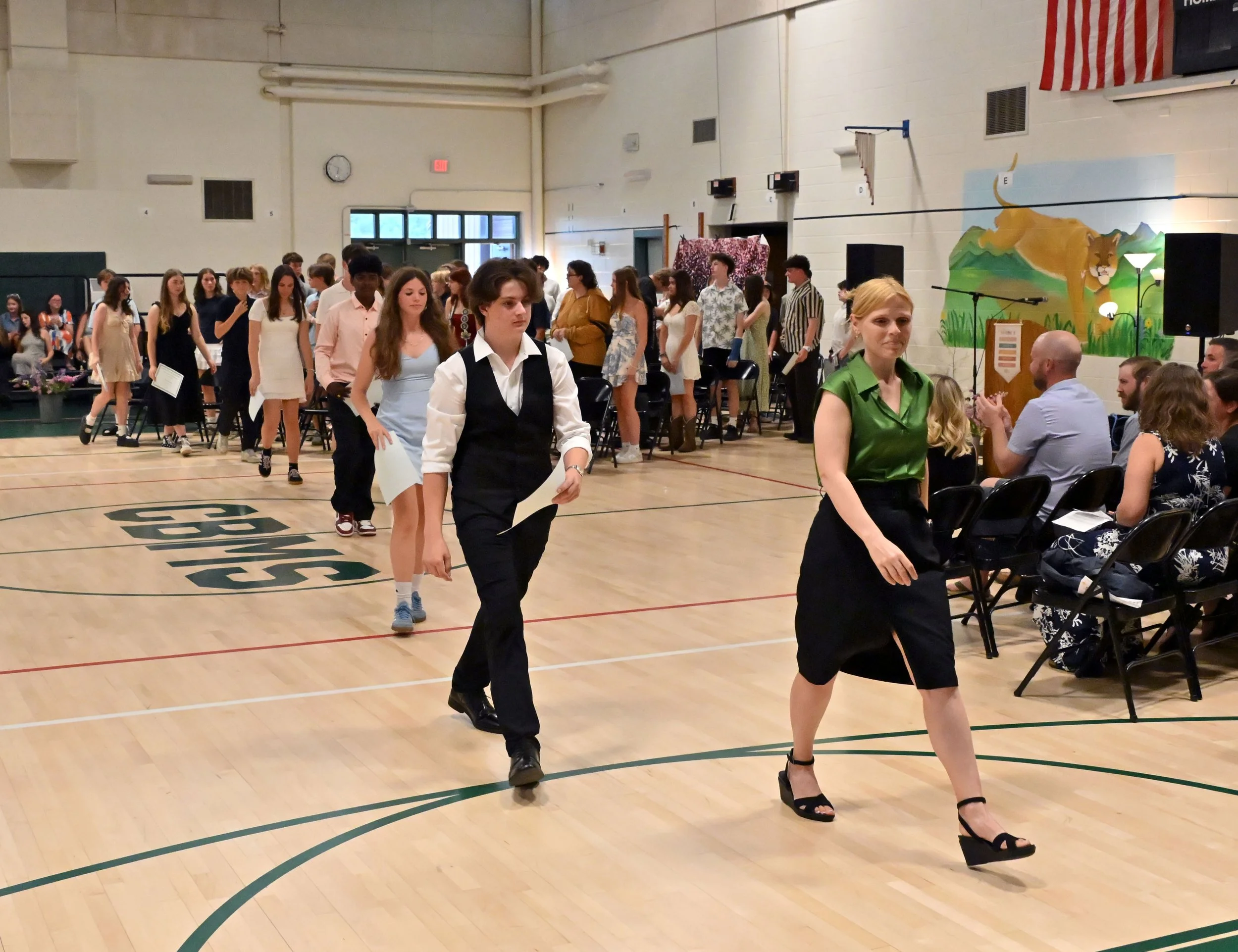  Co-Principal Jen Durren leads the class out of the gym at the ceremony's end. Photo by Gordon Miller  