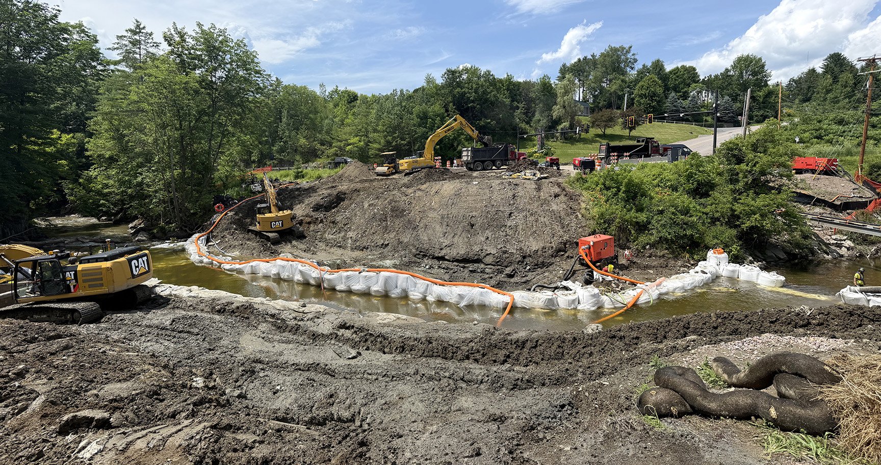 Friday July 11: The workers continue digging with the help of cofferdams. Photo by Gordon Miller