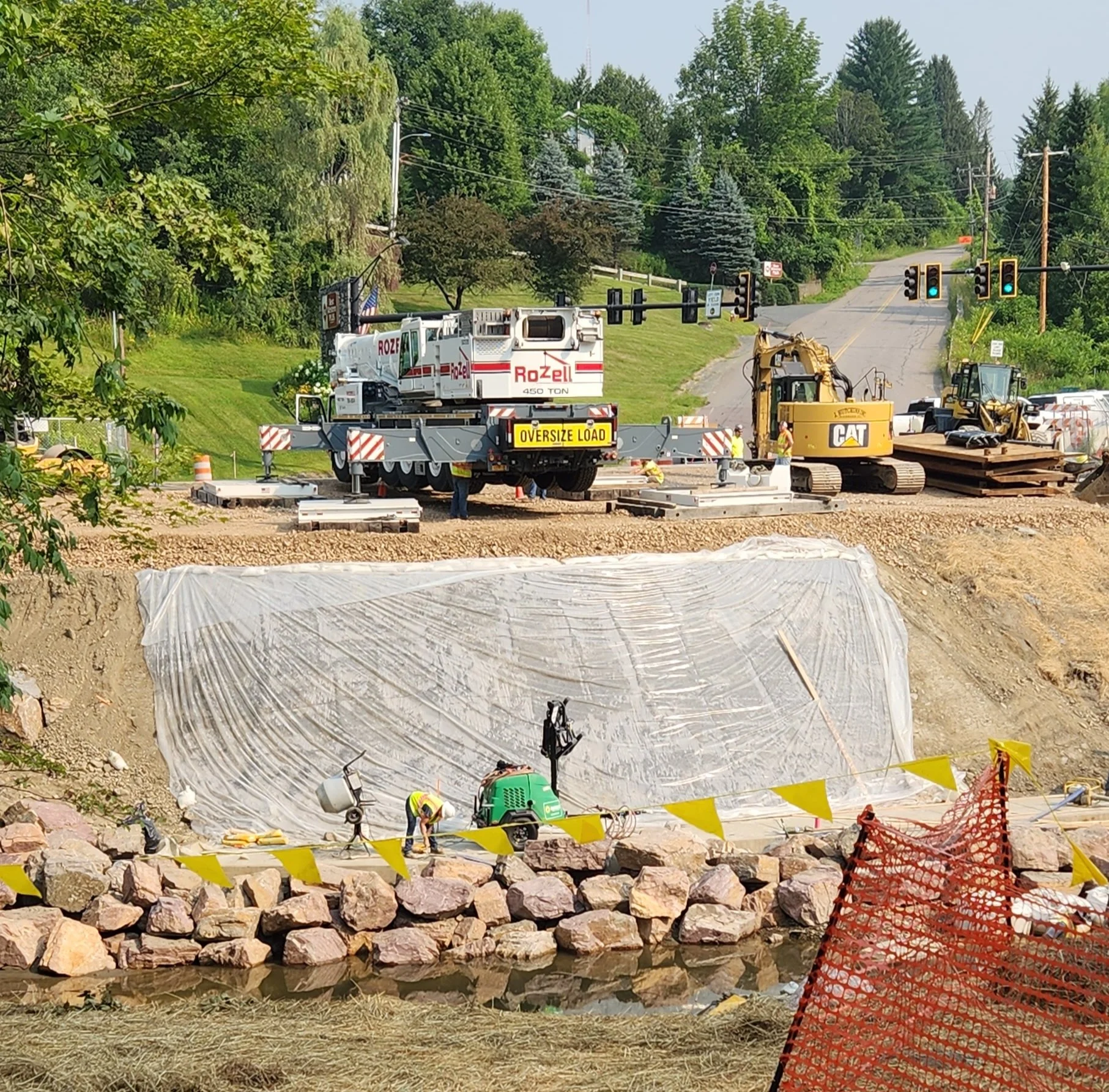   The construction crane is moved to the top of the bank on the Route 100 side of the bridge site. Photo by Jeanne Atchinson  