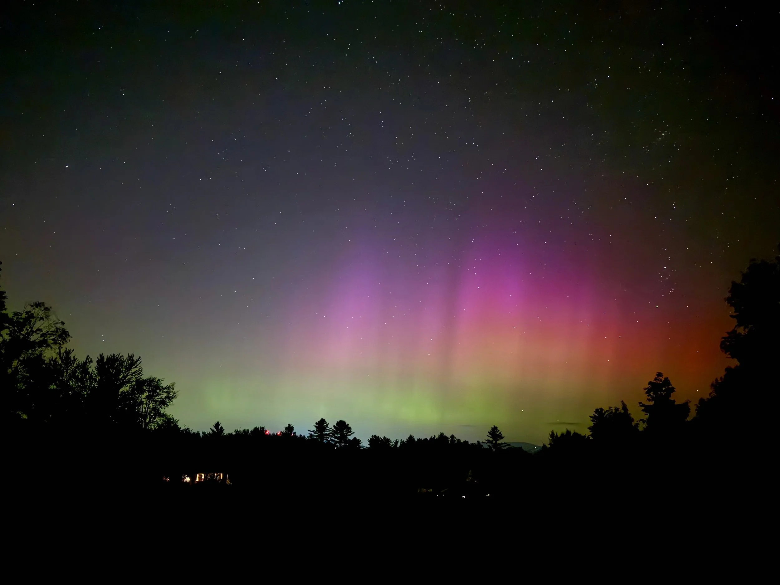   Carmen Haslam captured this image just after 8:30 p.m. from Cobb Hill in Moretown. The red dots just above the trees on the left are the Blush Hill radio towers.  