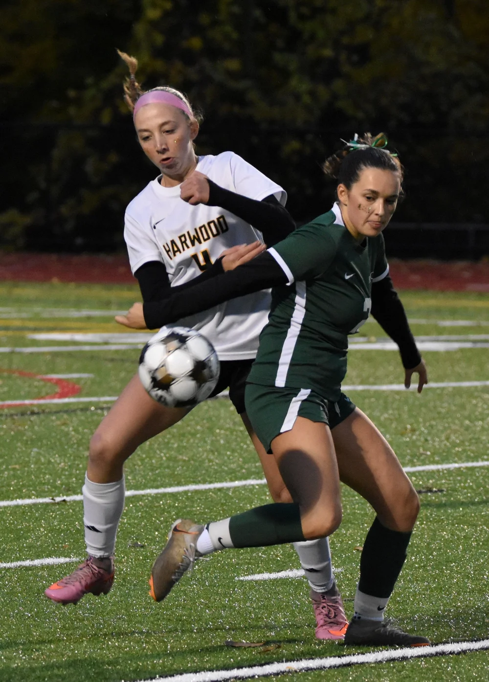   Harwood sophomore Bridan Merrill battles for the ball. Photo by Angela Nadeau  