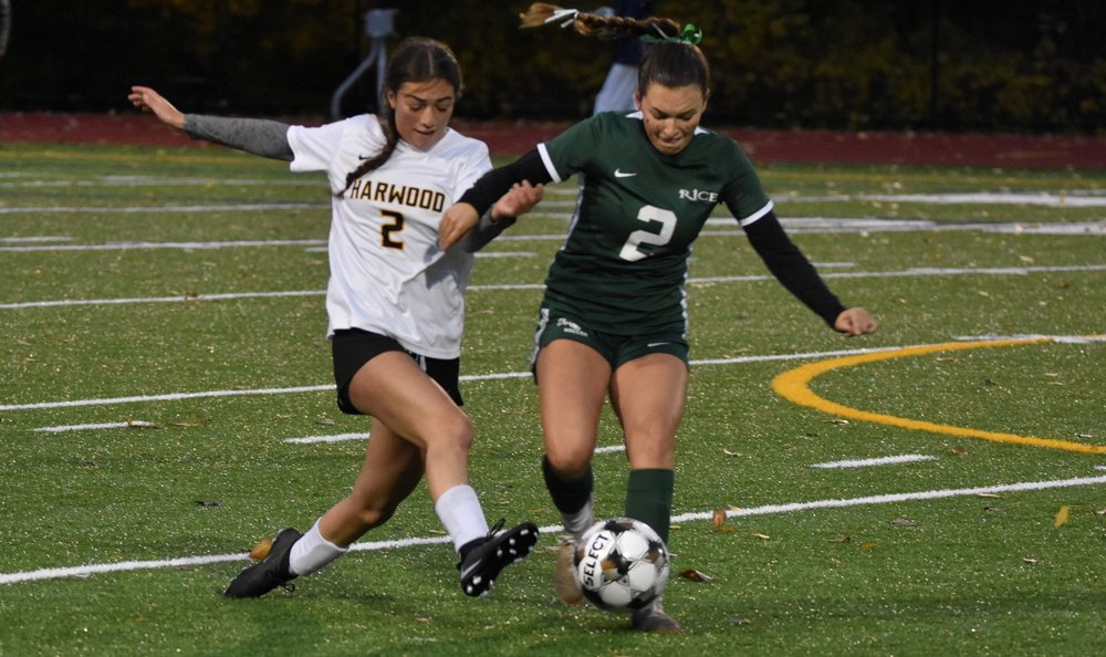  Junior Stella Mayone battles for possession.&nbsp;Photo by Angela Nadeau  