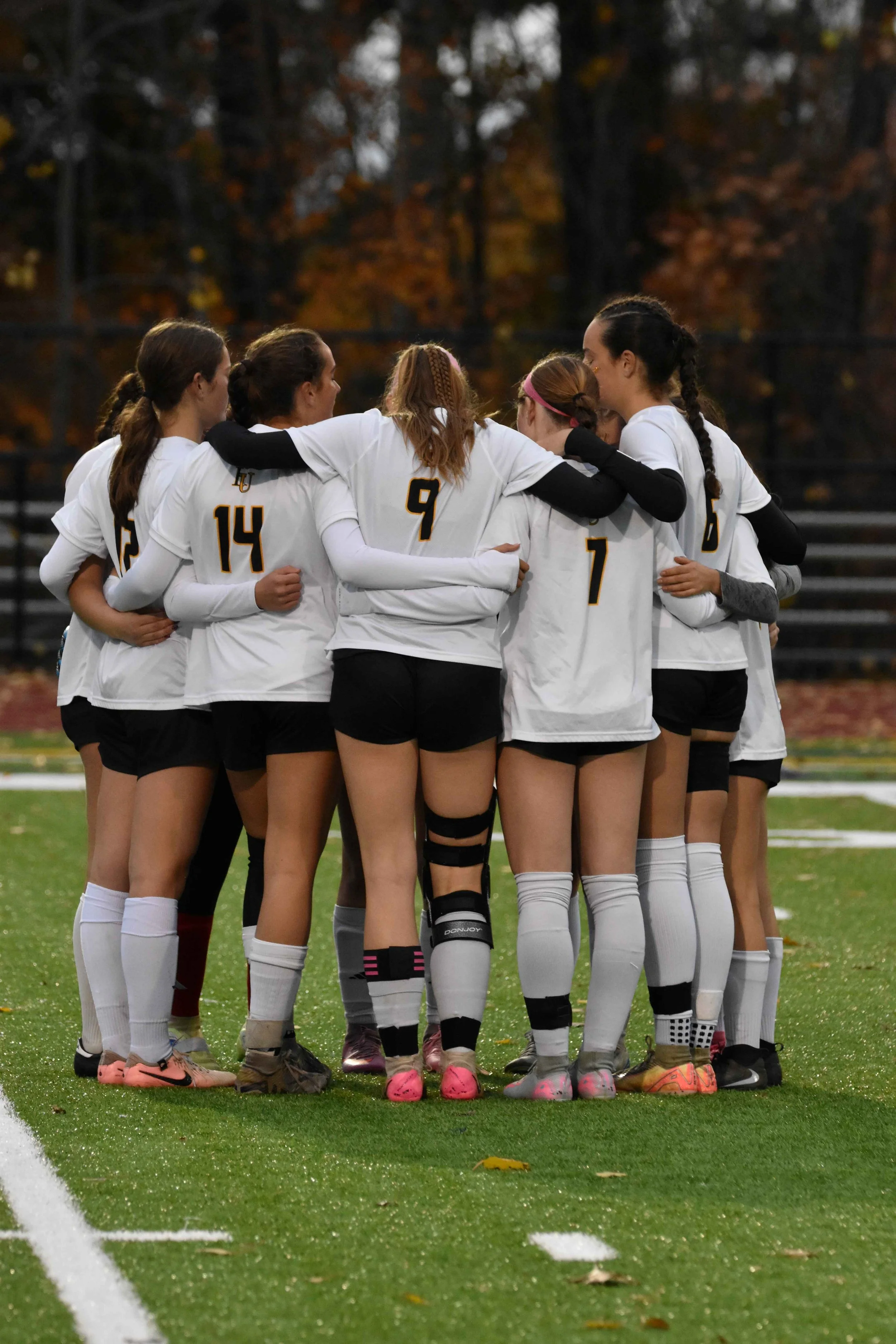   A timeout gives players time for a quick huddle. Photo by Angela Nadeau  