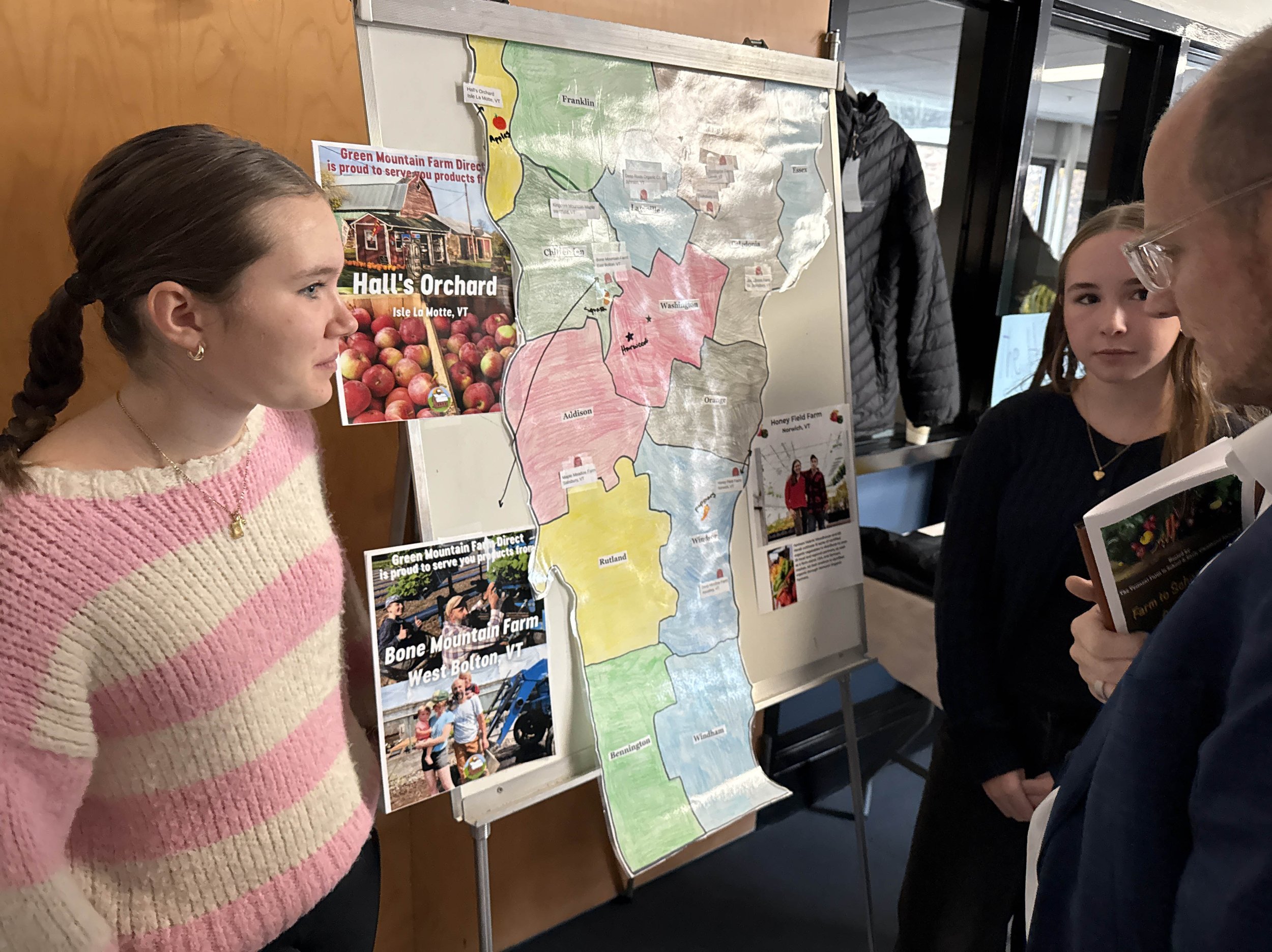   Harwood students Maeve Barry (left) and Vivienne Boyle visit with Vermont Health Commissioner Dr. Rick Hildebrant. Photo by Gordon Miller  