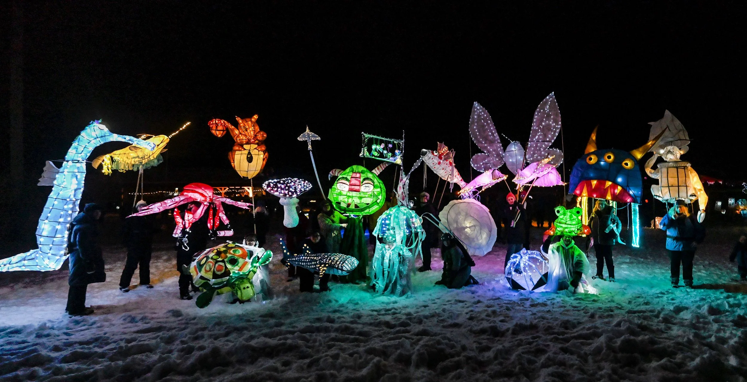   2024 parade participants with some of the larger, elaborate lantern creations gather for a group photo at the finish. Photo by Gordon Miller&nbsp;  