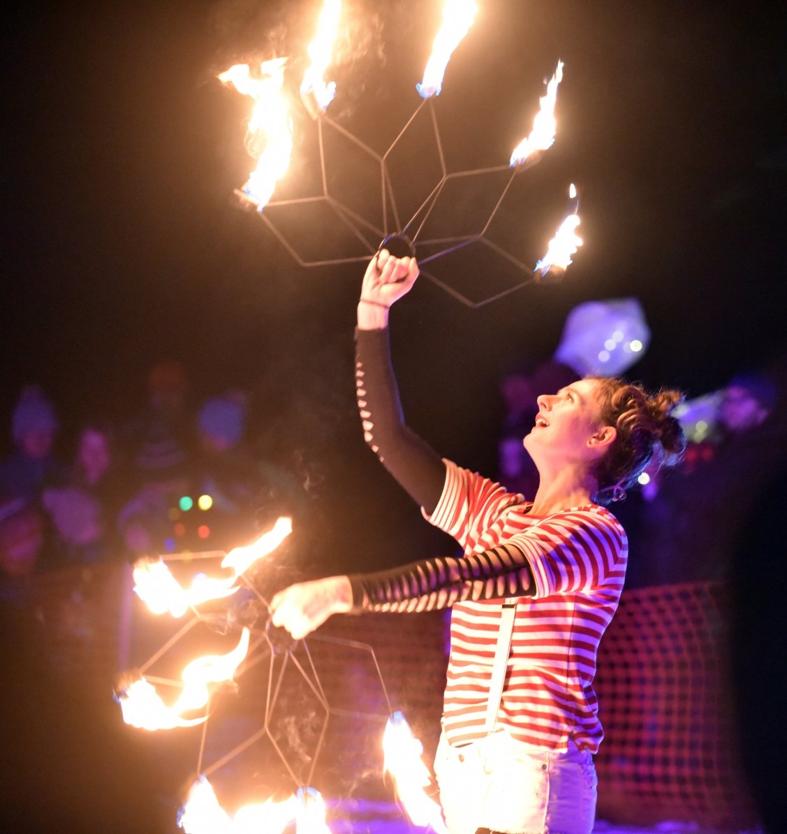  A fire spinner from Cirque&nbsp;de Fuego delights the crowd. Photo by Gordon Miller&nbsp;  