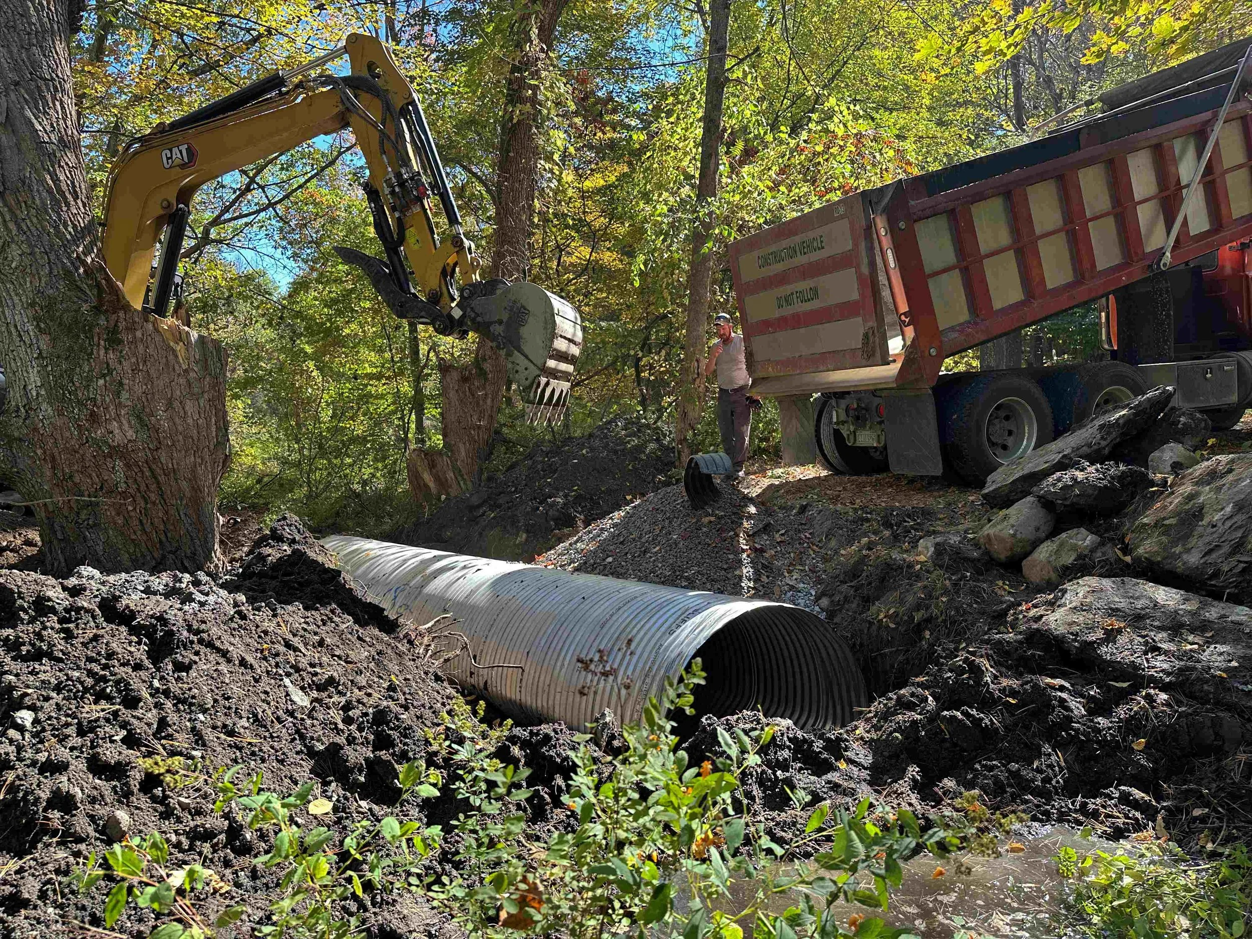   A new culvert over 5 feet wide is installed in the stream bed. Vt. Land Trust photo  