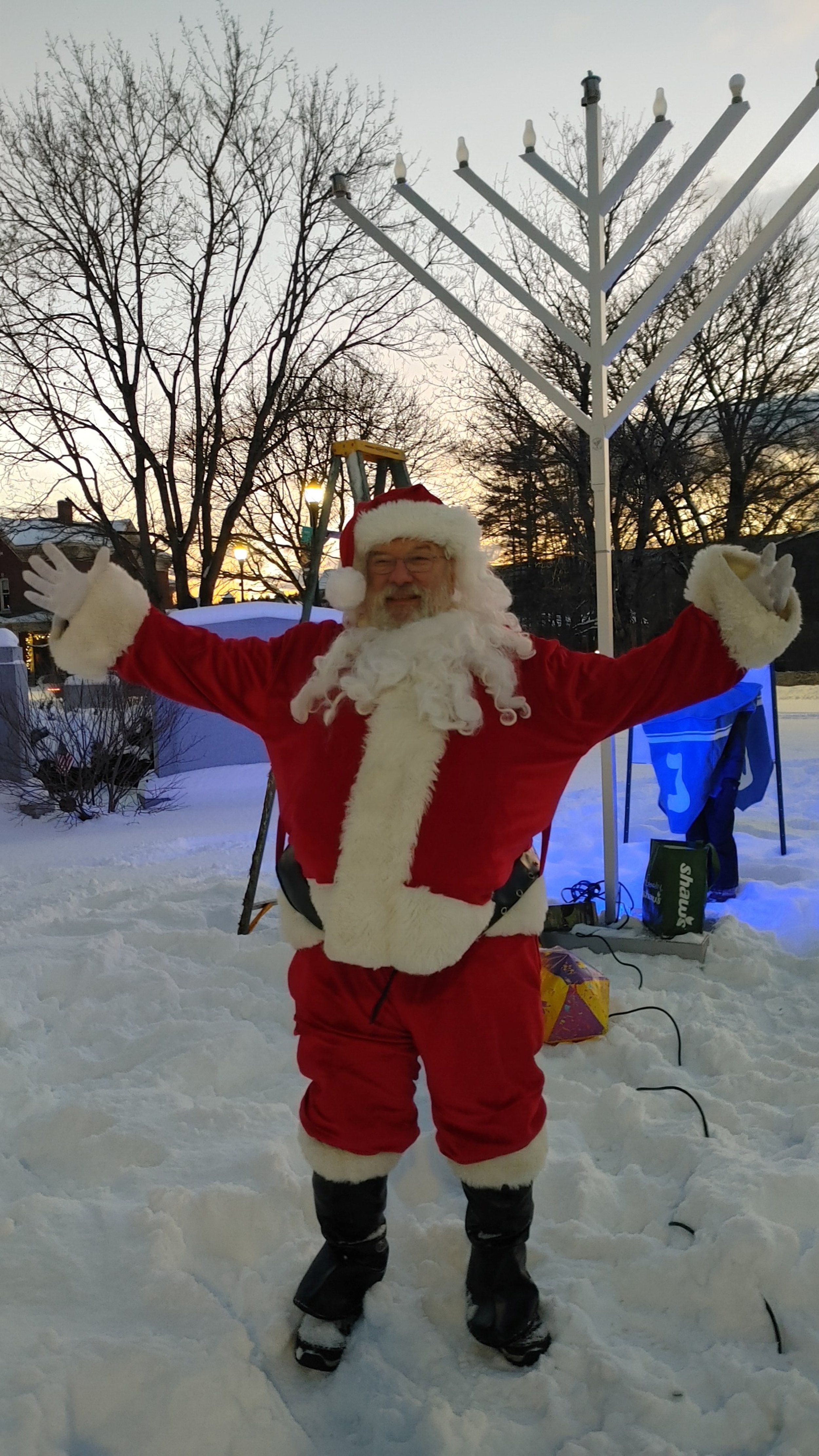  Santa joins in the celebration at the menorah lighting on the first night of Chanukah. Photo by Debbie Bard 