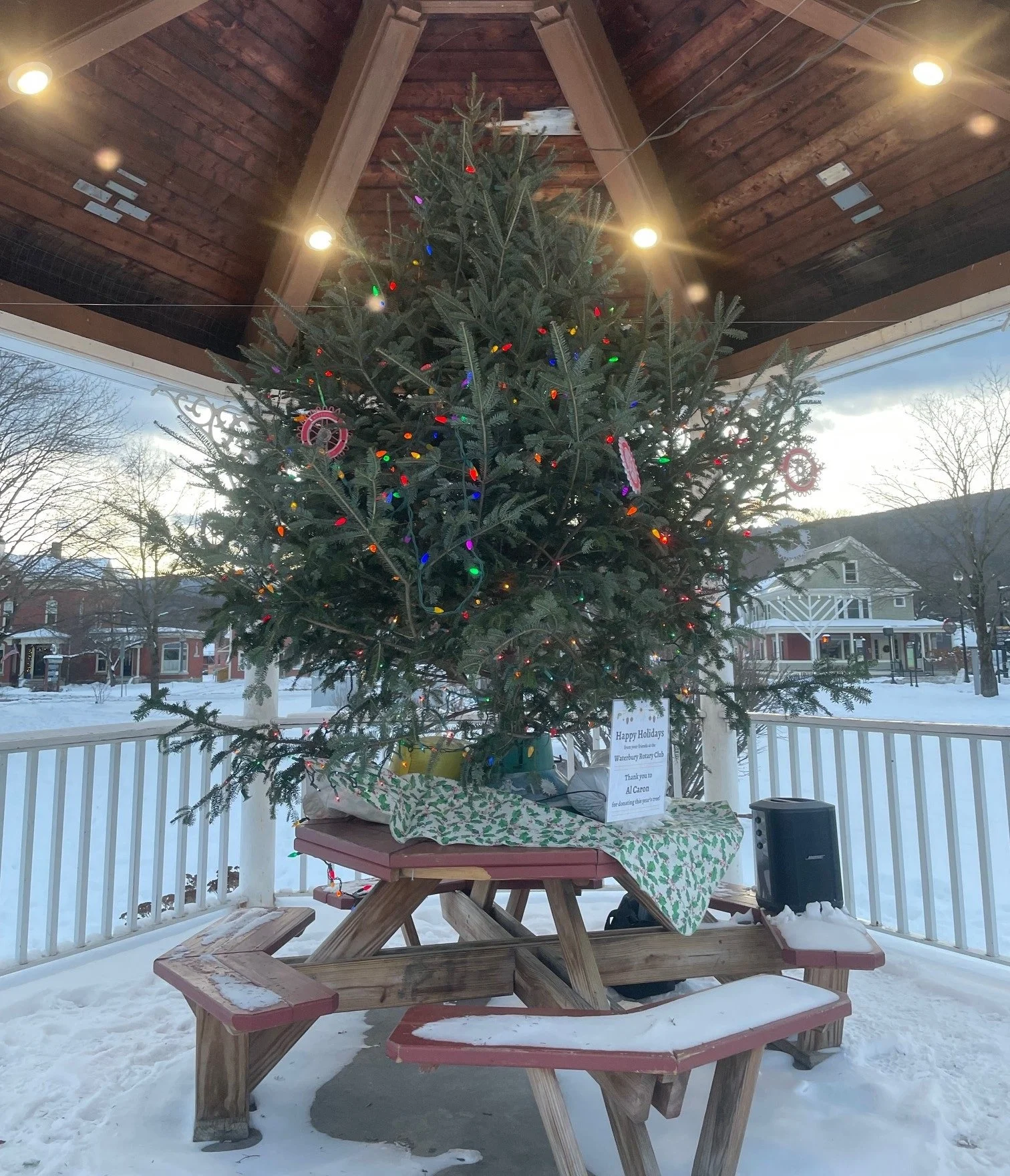  Waterbury Rotary Club members add the tree to the Rusty Parker Park gazebo each year. Photo by Ron Gulyas  