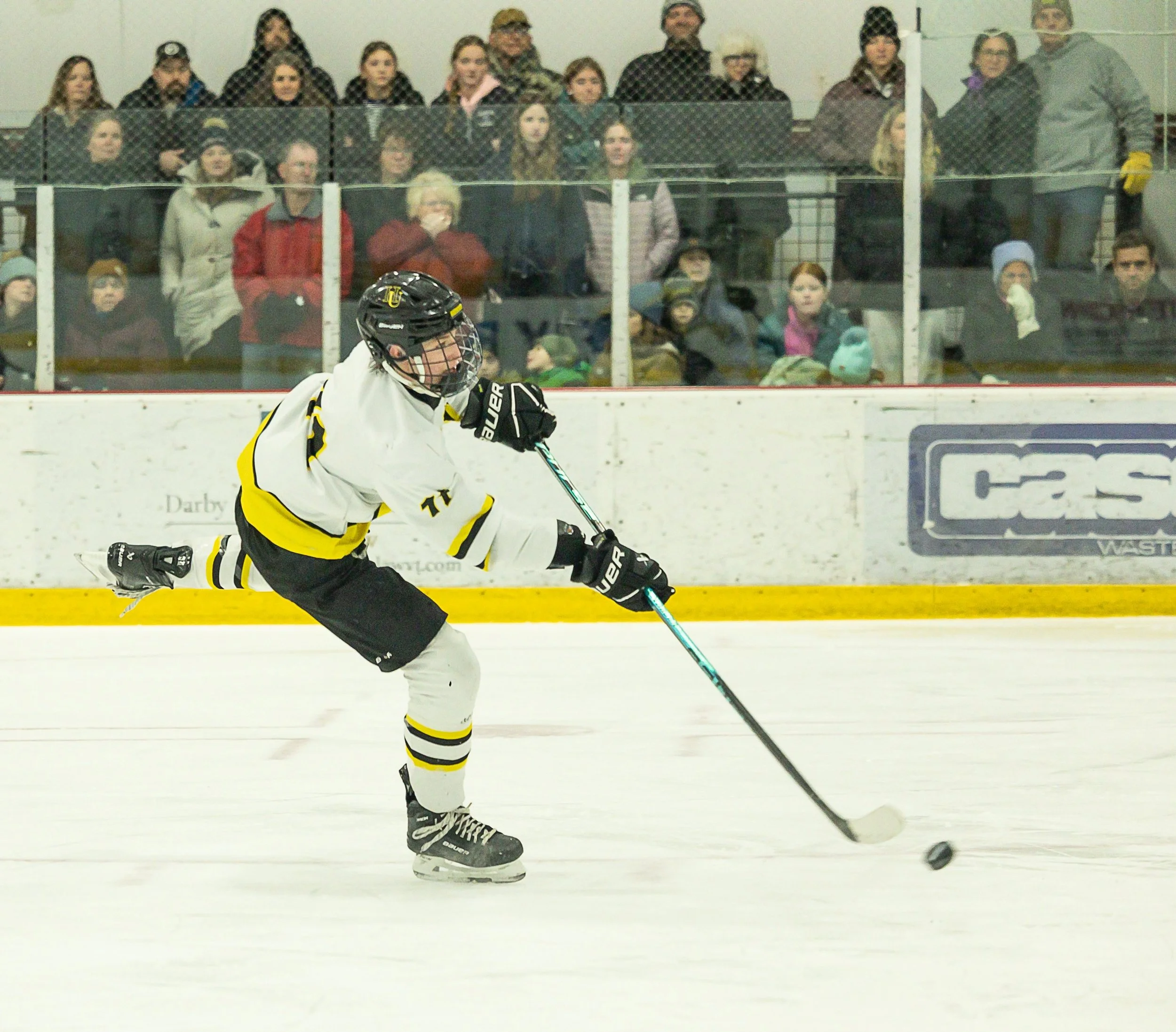  Harwood's Griffin Nelson takes a shot on goal during the Dec. 30 home game against Spaulding. Photo by Michaela Milligan 