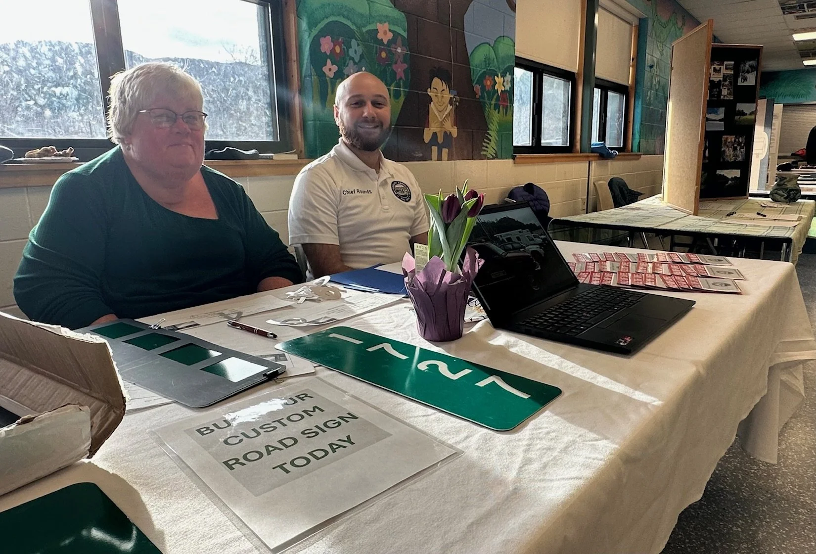  Anne Hutchinson and Chief Zach Rounds of Waterbury Ambulance Service staff their info table at Say Day. Photo by Lisa Scagliotti  