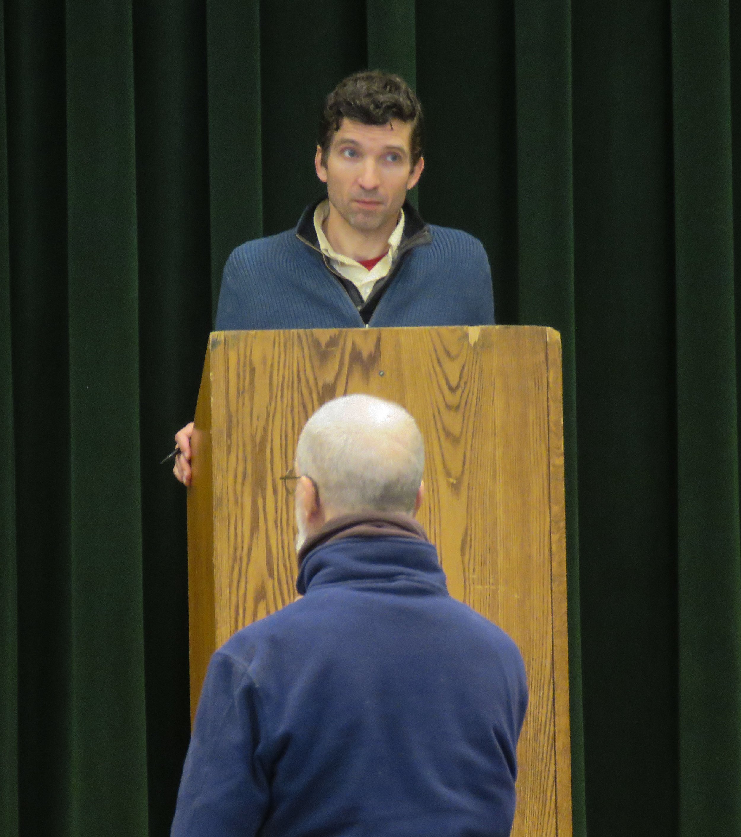  Moderator Dan Senning at the podium keeps the conversation moving along. Photo by Shawnee Perry 