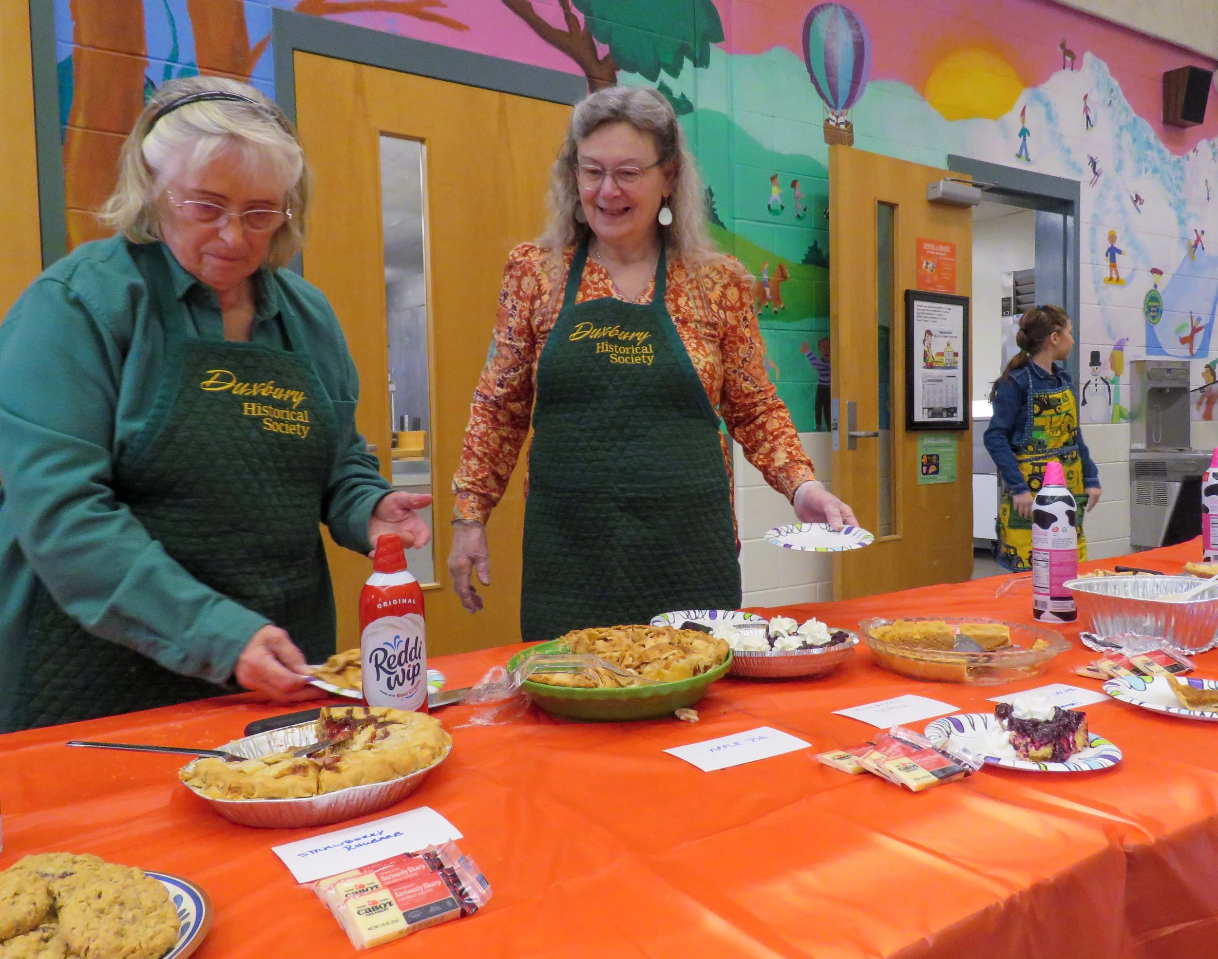 Duxbury Historical Society members serve pies contributed by meeting attendees. Photo by Shawnee Perry 