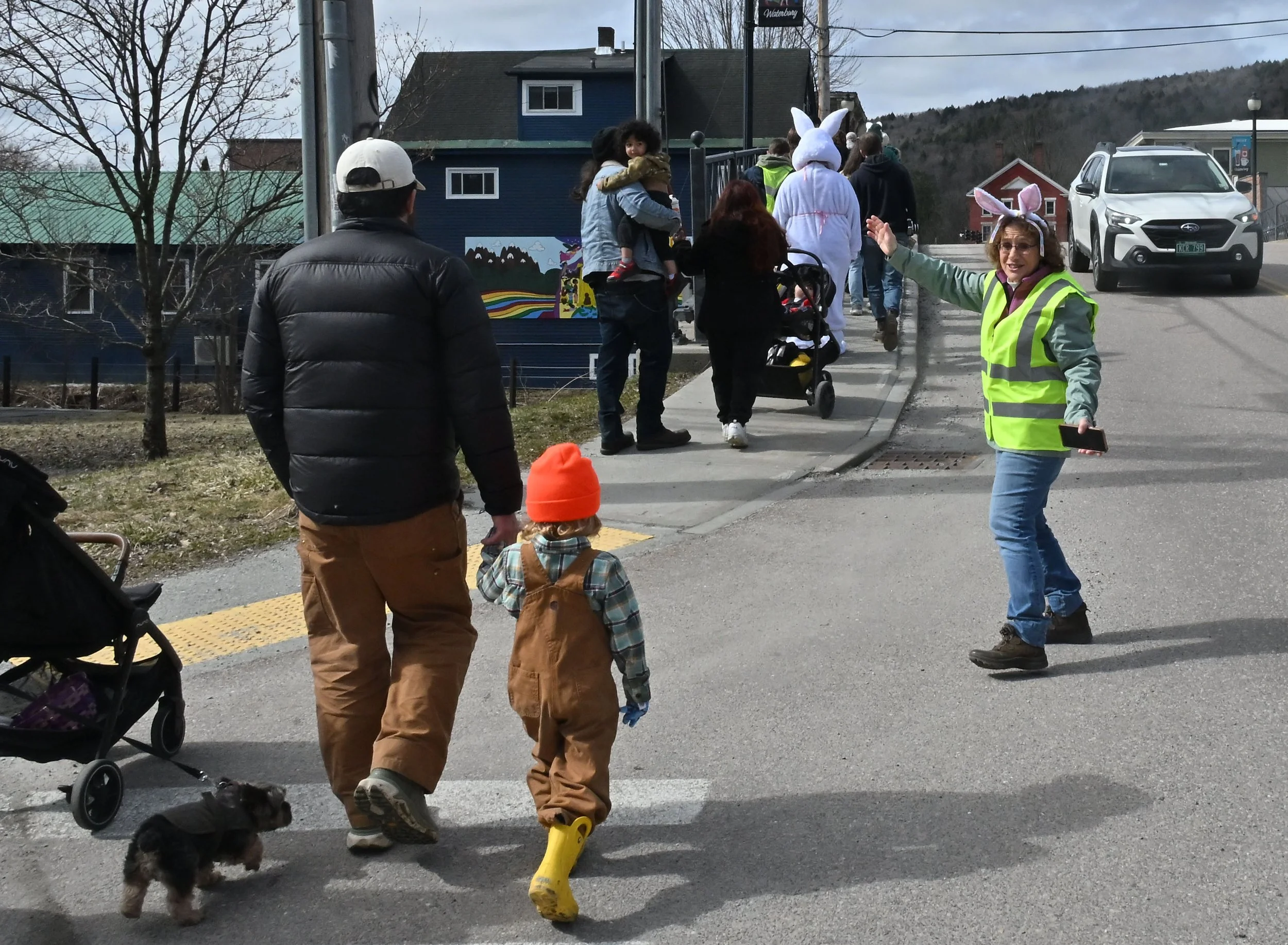   This parade sticks to the sidewalks so as not to disrupt traffic. Photo by Gordon Miller  