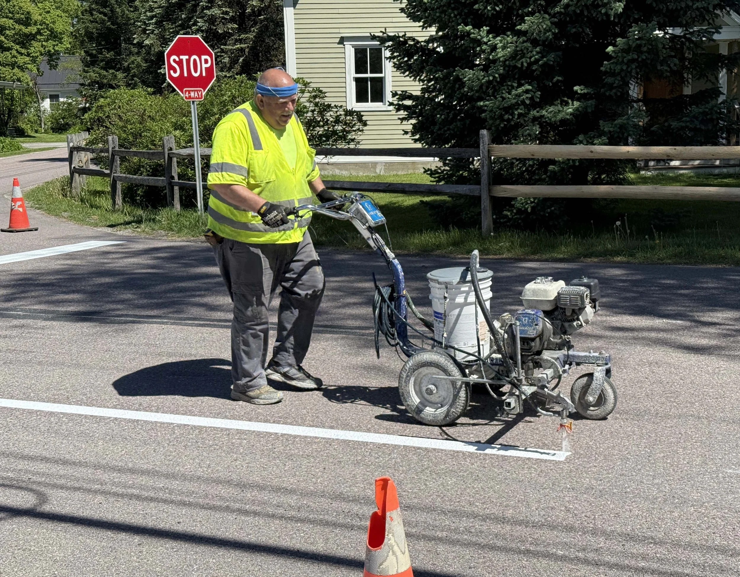  Mike LaRock with Scott's Line Striping applies paint to add new pavement markings. Photo by Gordon Miller 