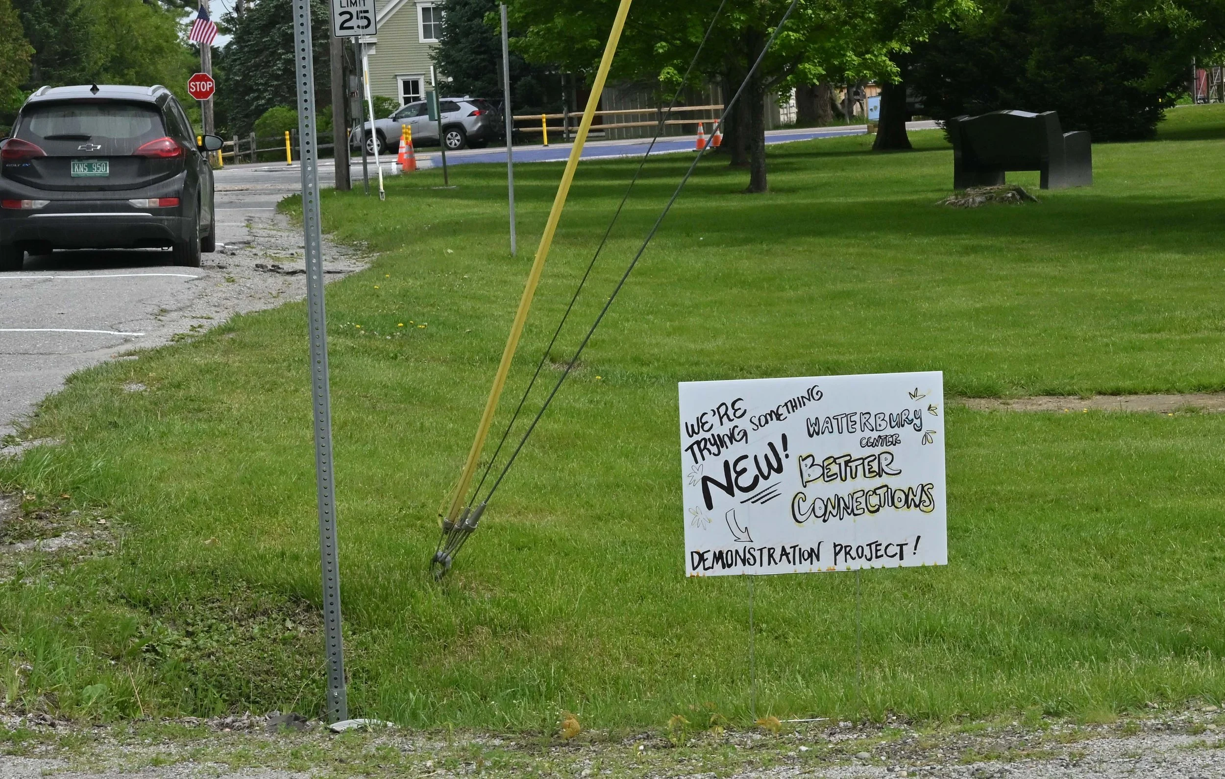  Signs on the triangle park announce the project. Photo by Gordon Miller 