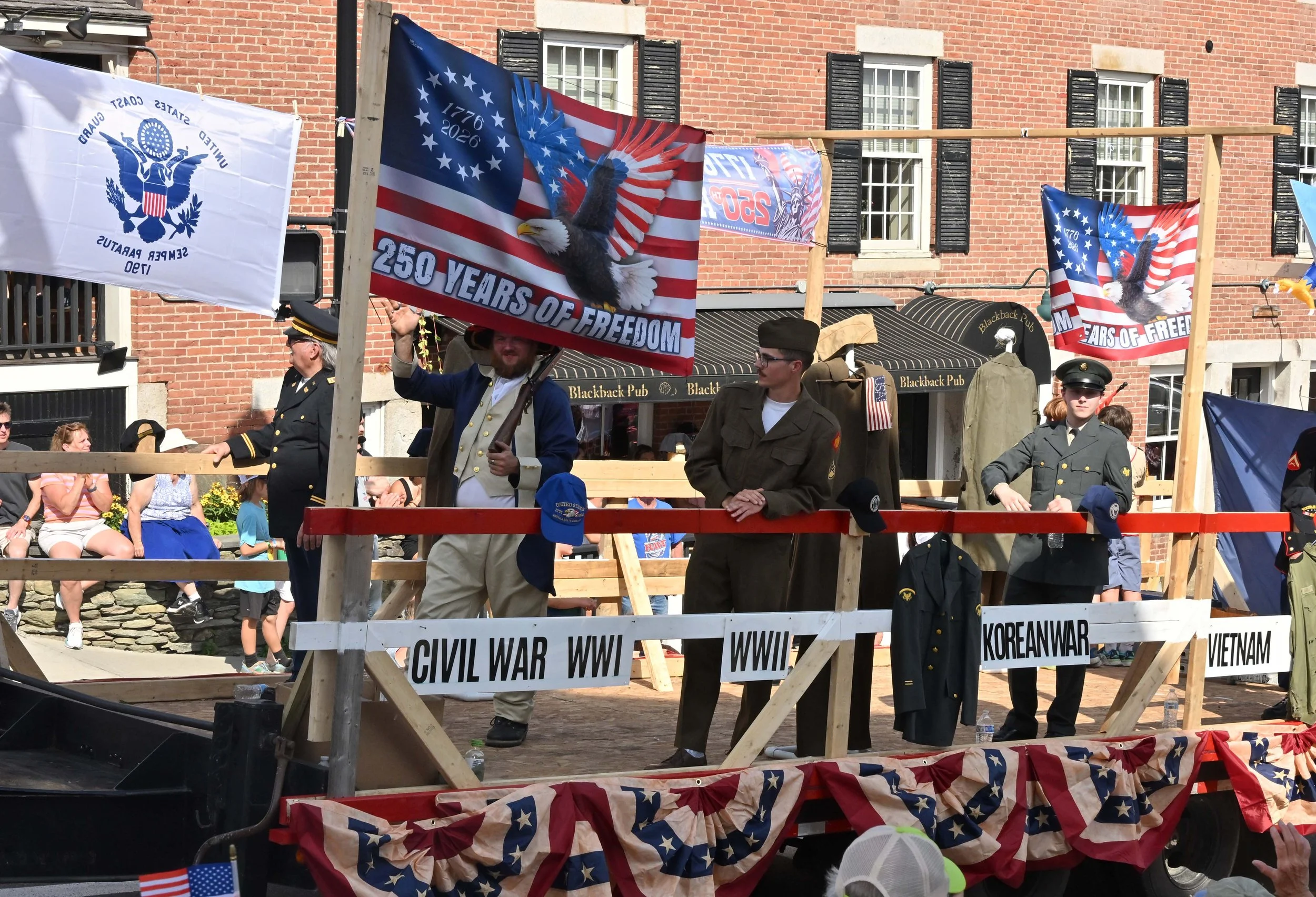  The American Legion float showcasing vintage military uniforms from the Revolutionary War through Desert Storm won Most Patriotic honors. Photo by Gordon Miller 