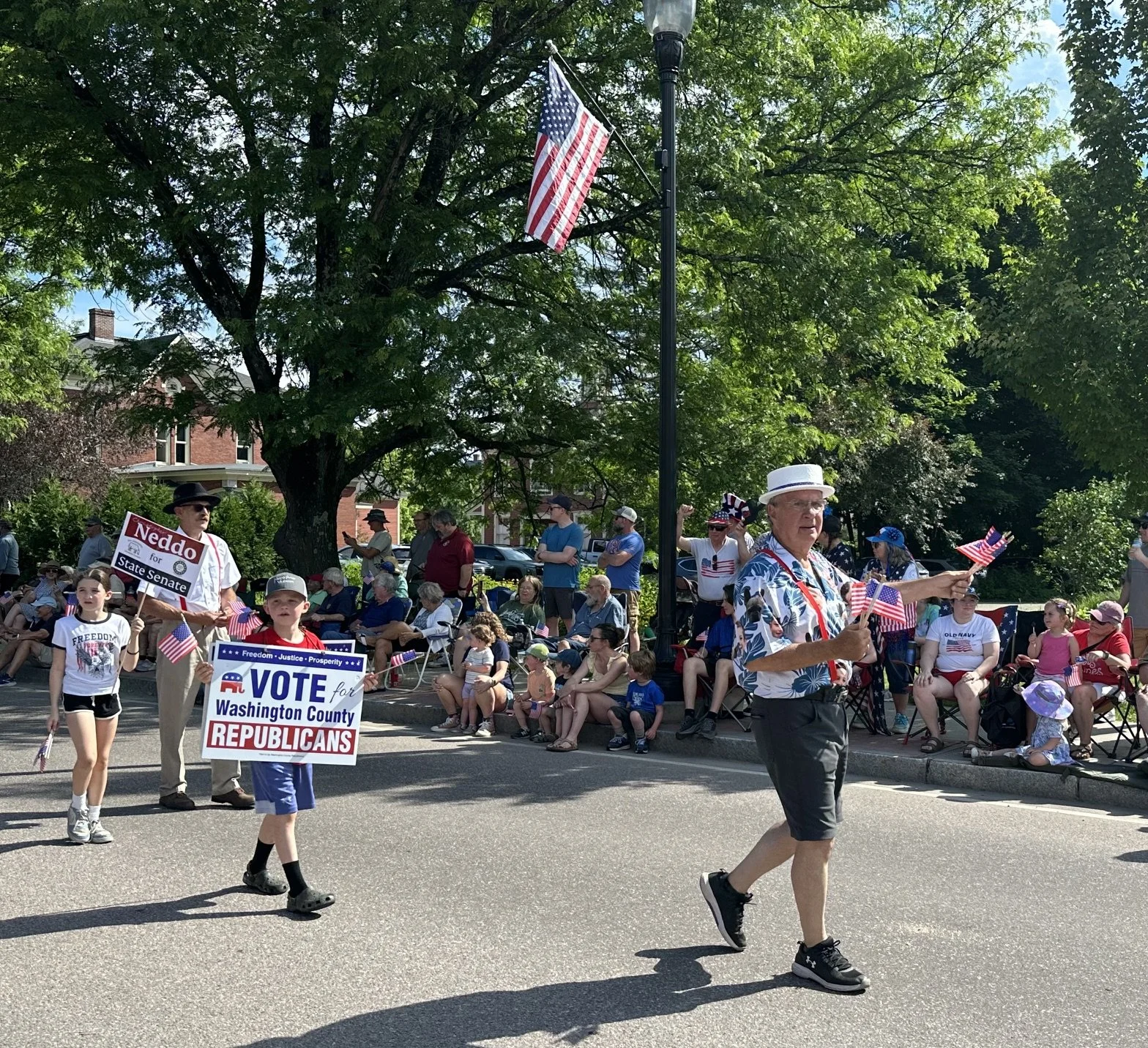  Republican state Senate candidate Rob LaClair greets parade-goers. Photo by Lisa Scagliotti 