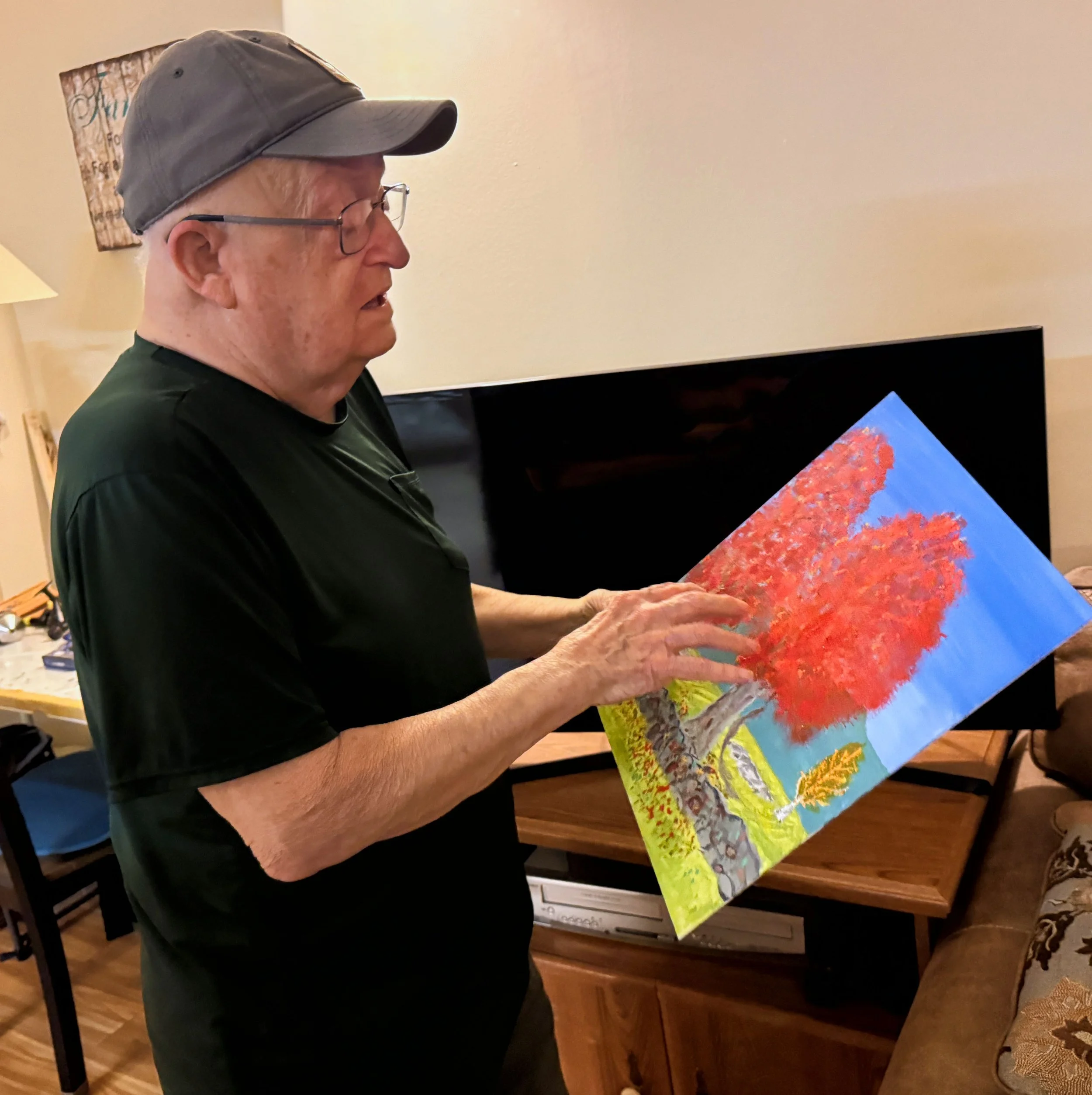  Doug Perry likes to go outdoors to paint, sharing a piece he created last fall. Photo by Gordon Miller 