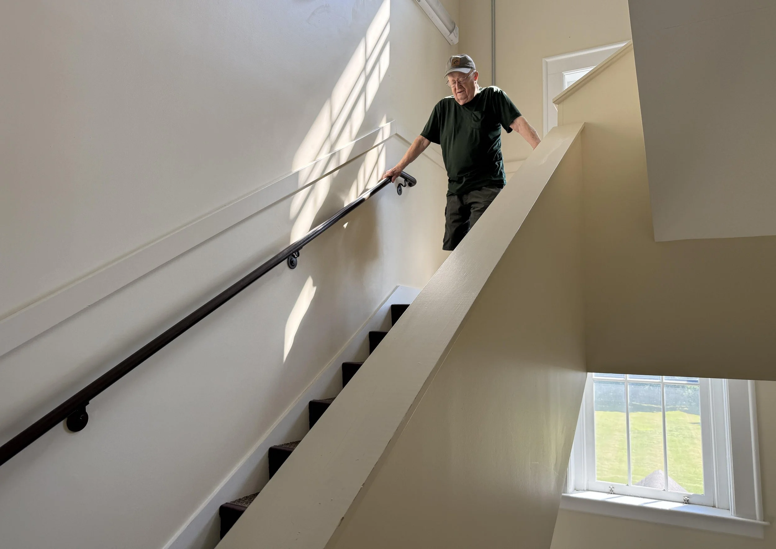  Doug Perry says going down the back staircase is manageable, but heading up while carrying groceries or other items is a challenge. Photo by Gordon Miller 