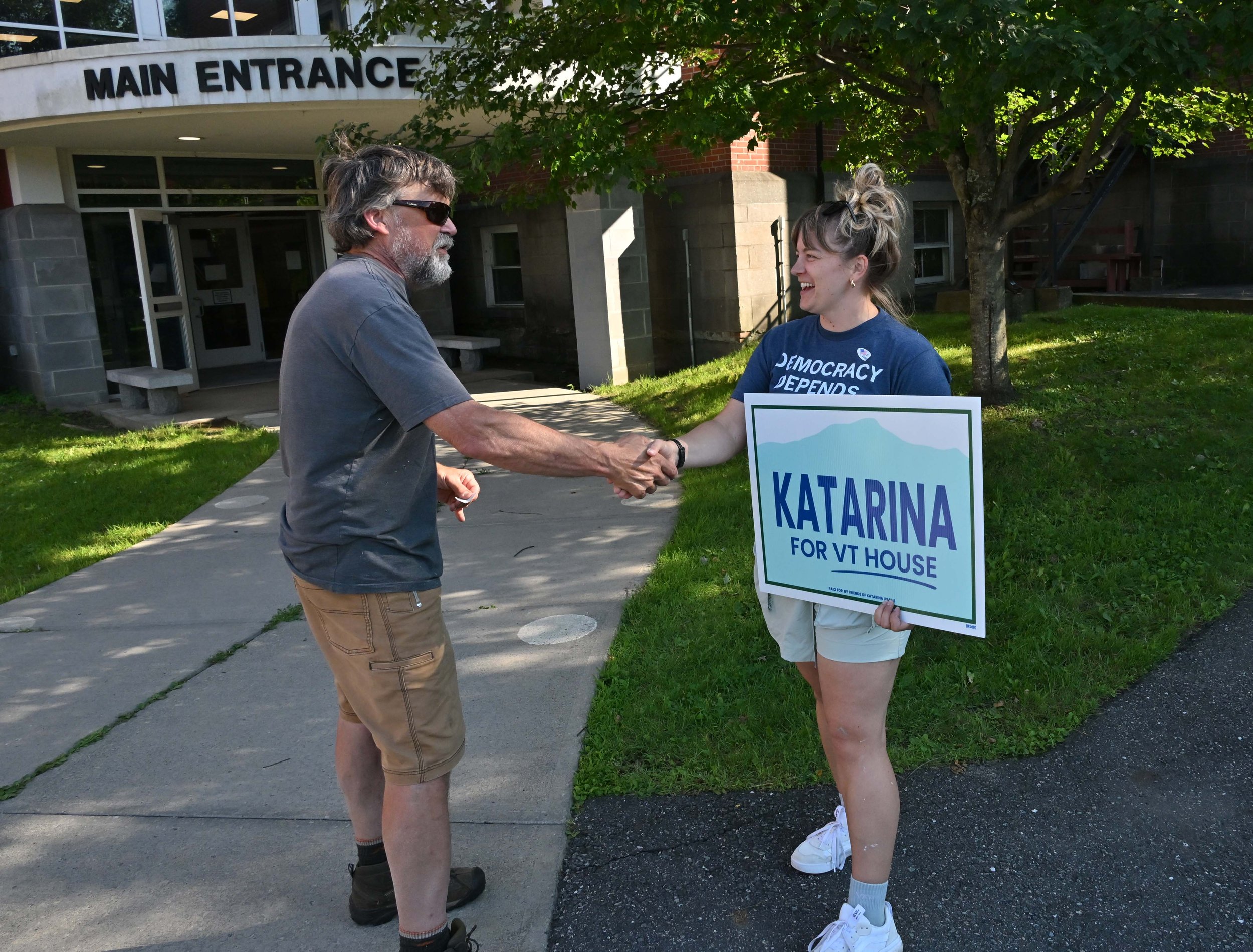   Voter John Wolfe meets Democratic House candidate Katarina Lisaius. Photo by Gordon Miller  