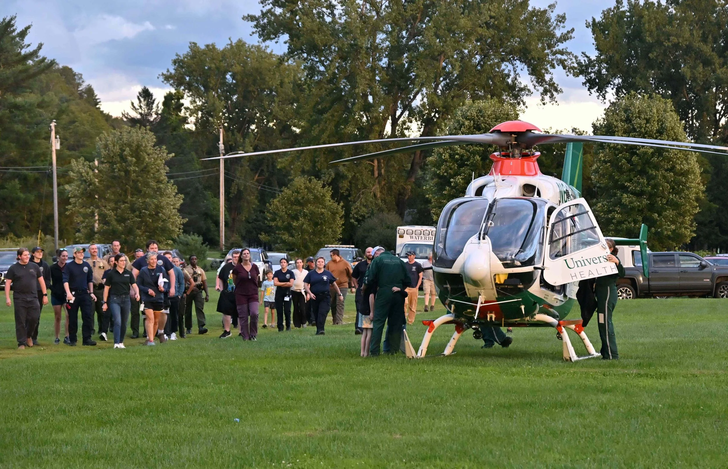   First responders gather at the field after a training session at the downtown Waterbury Ambulance station. Photo by Gordon Miller   