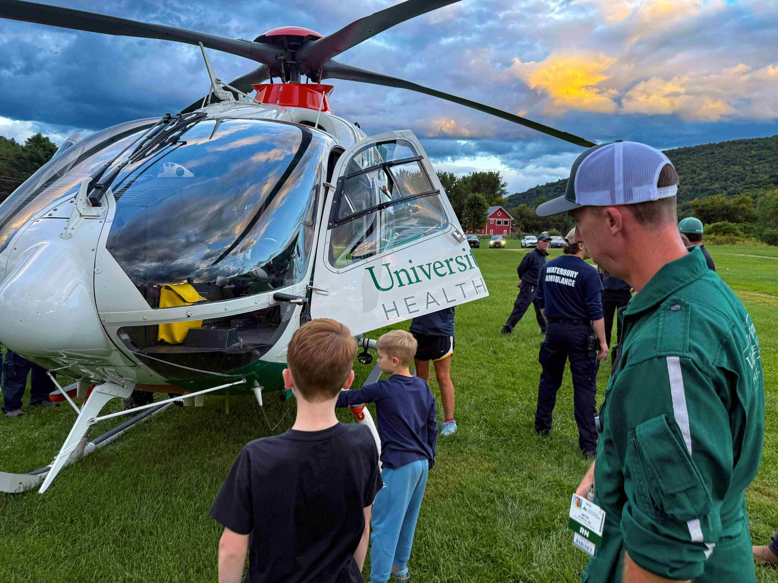   Flight crew member and Waterbury resident Seth Kunkle is joined on the ground by his kids for a close-up look. Photo by Gordon Miller  